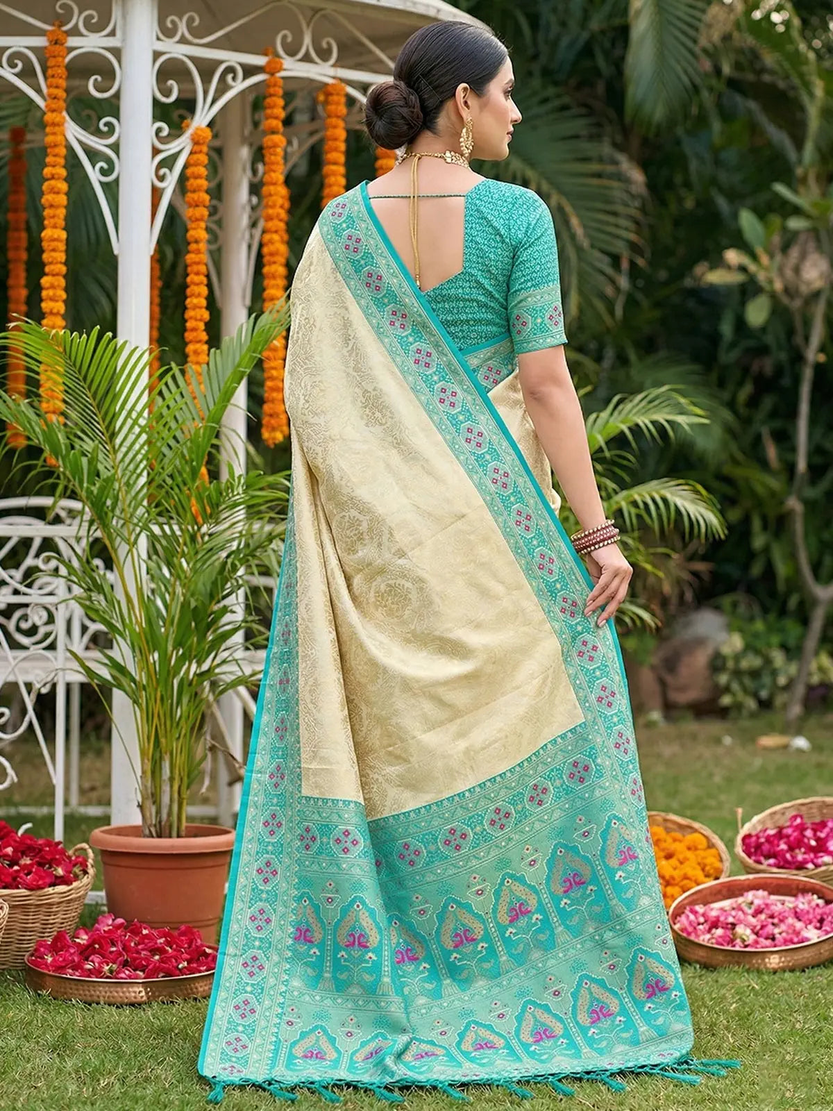 Tarani Avantika premium soft silk teal saree back view with woven pallu and designer border detailing