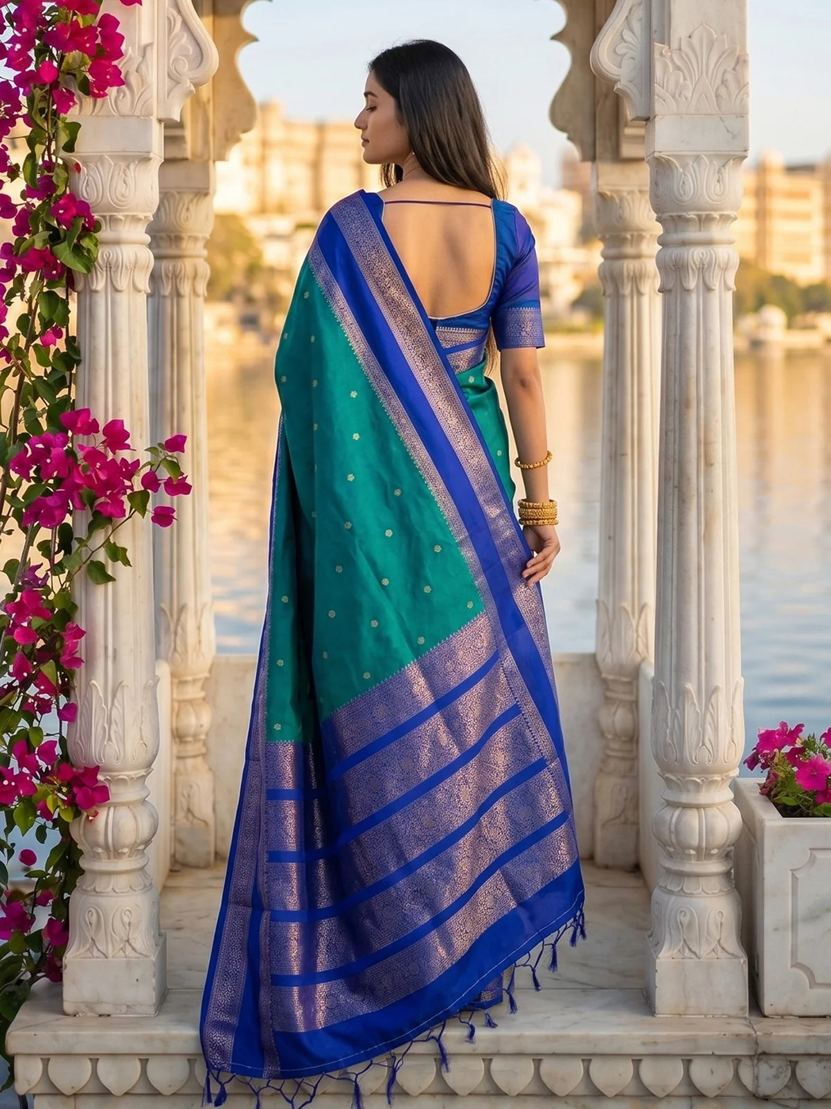 Tarani teal soft silk saree back view with royal blue zari pallu and stylish blouse design