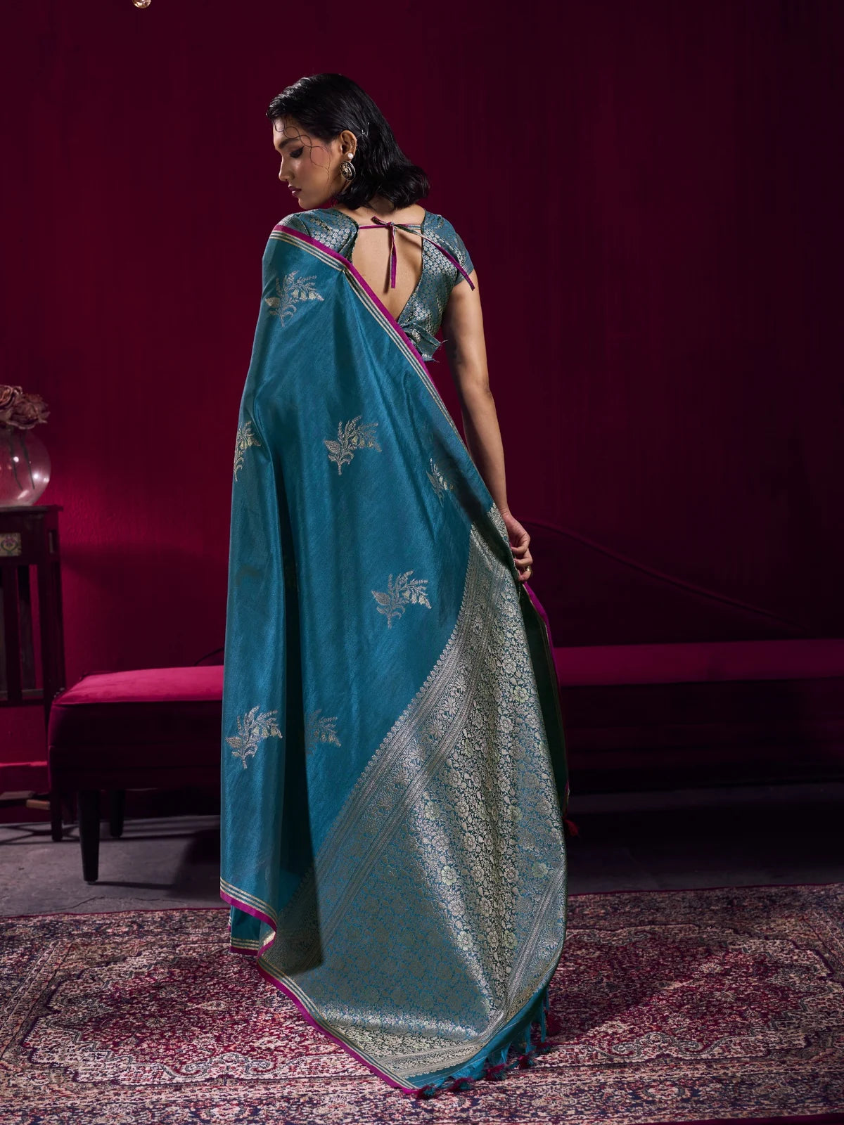 Tarani teal handloom weaving silk saree back view with elegant blouse pattern