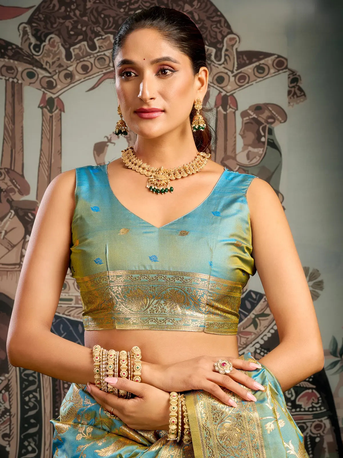 Tarani teal silk saree closeup showing blouse and zari detailing