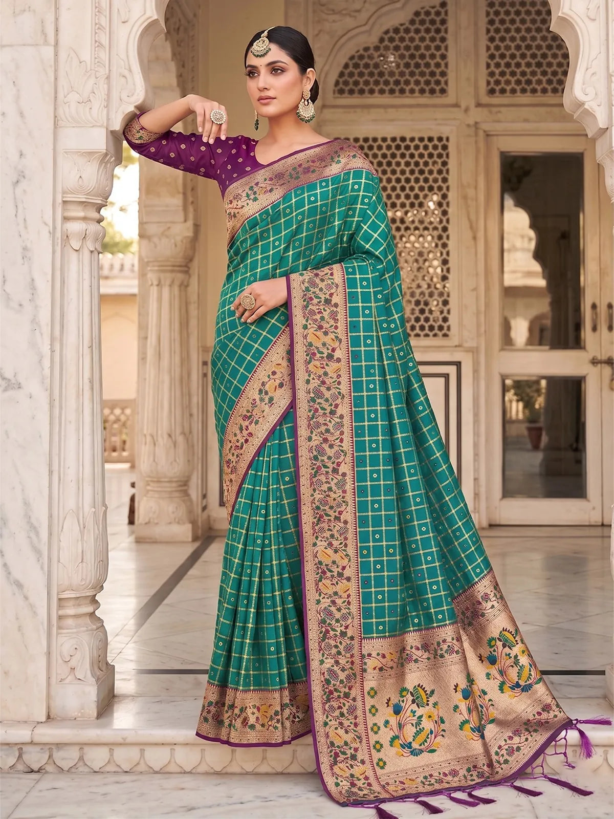 Tarani Yutika teal Banarasi silk saree elegant front pose with floral pallu