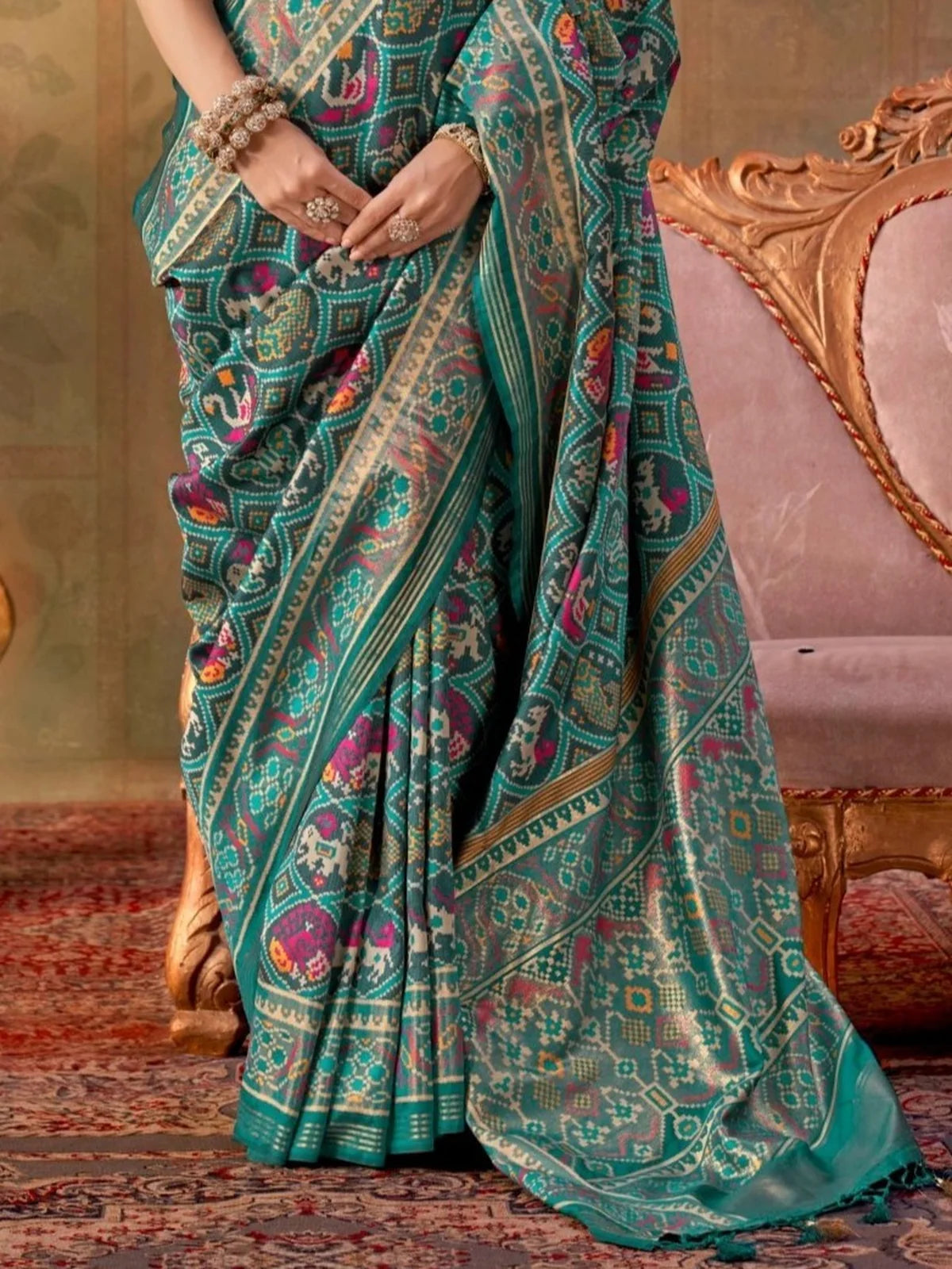 Tarani teal silk Patola saree pallu view with intricate woven jari design