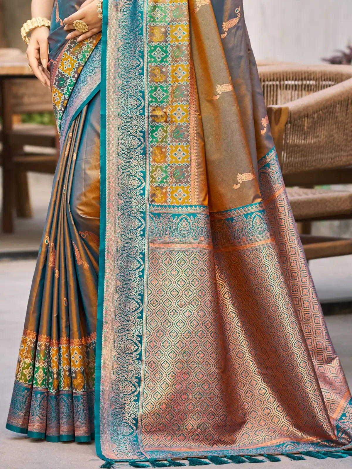 Tarani teal soft silk saree pallu closeup with woven zari border detailing