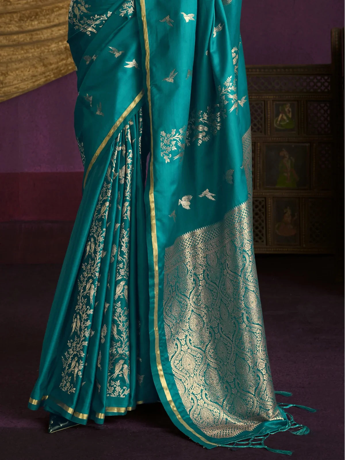 Tarani pallu view of teal satin weaving silk saree with rich golden brocade work