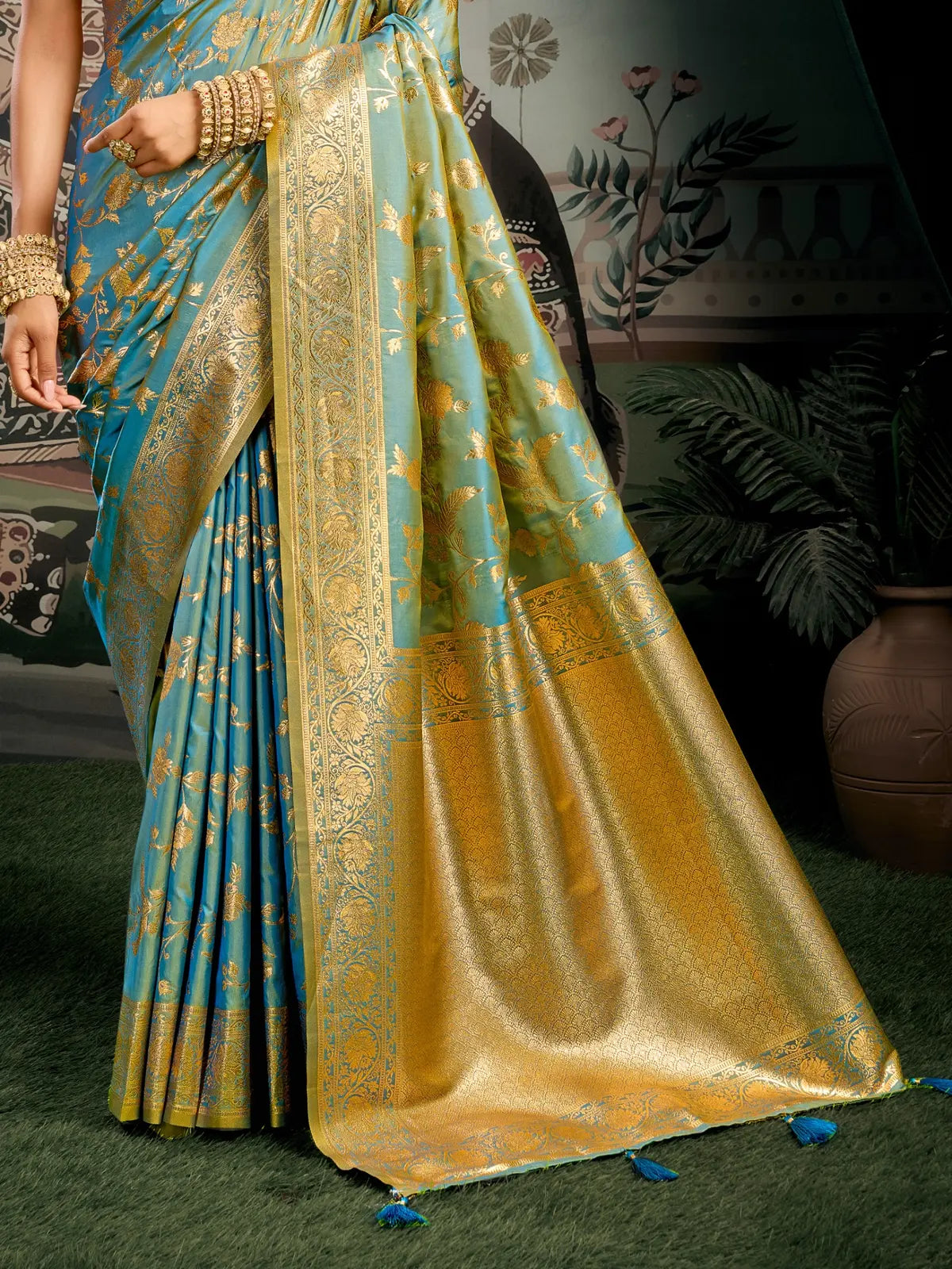 Tarani teal silk saree pallu view with golden zari work