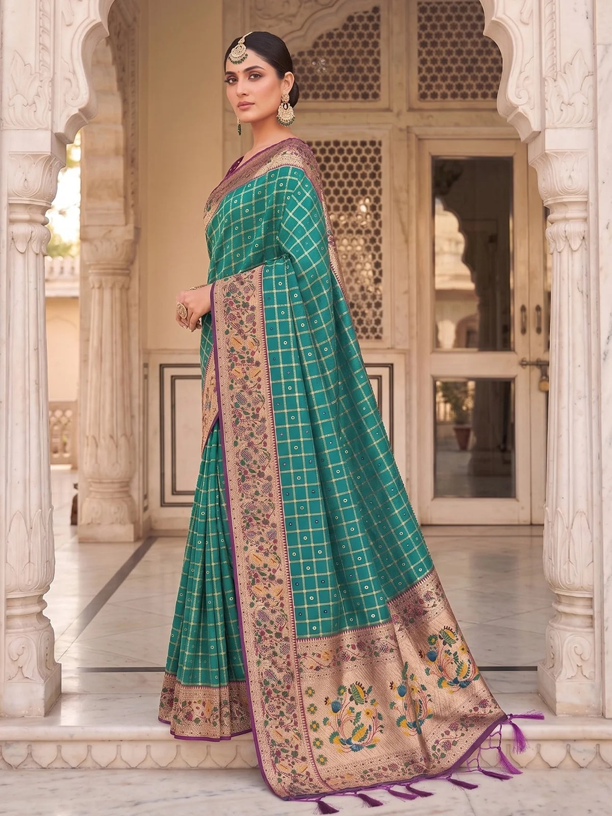 Tarani Yutika teal Banarasi silk saree side view showing woven border details