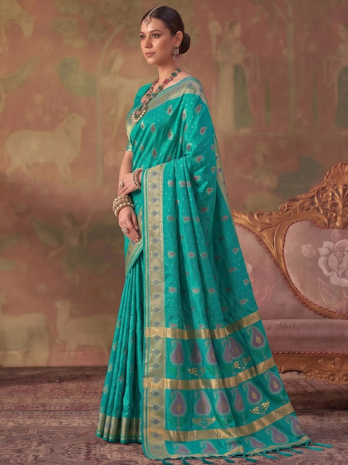 Tarani teal silk saree with zari weaving elegant side view and woven border