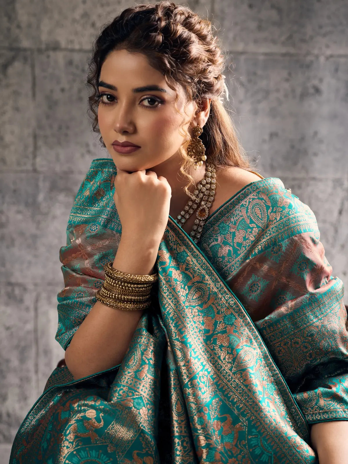Tarani teal Banarasi silk saree upper body view showing woven border and blouse