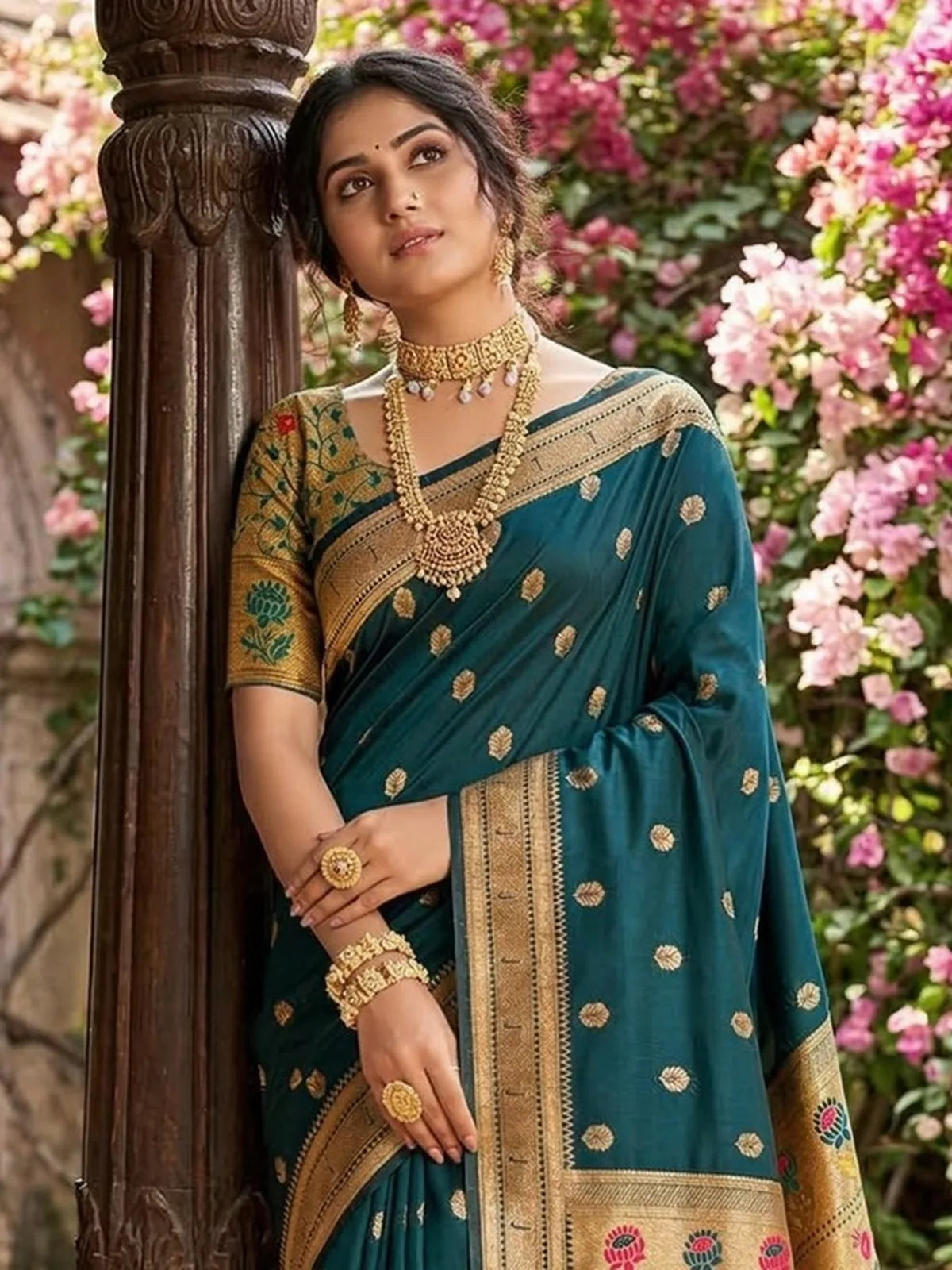 Tarani teal soft silk saree upper body view showing zari motifs and blouse design