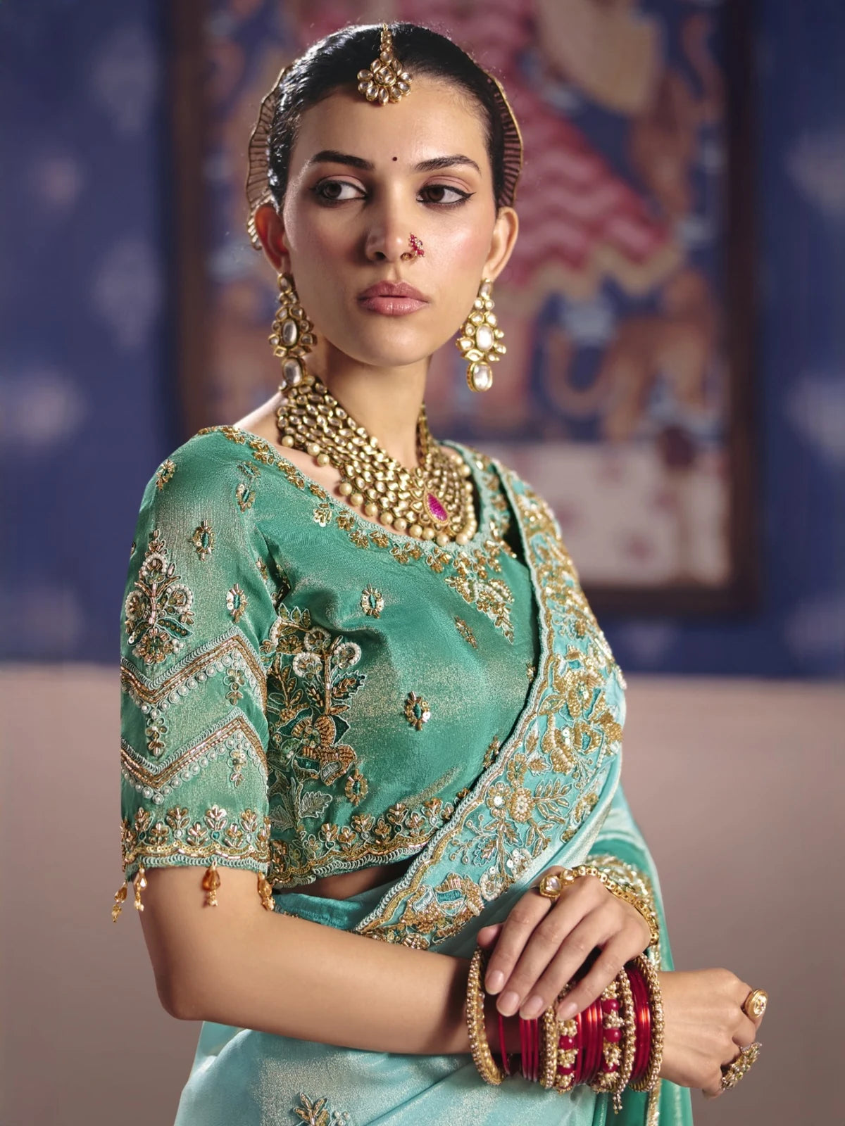 Tarani Adhira teal embroidered saree with heavy blouse upper body view