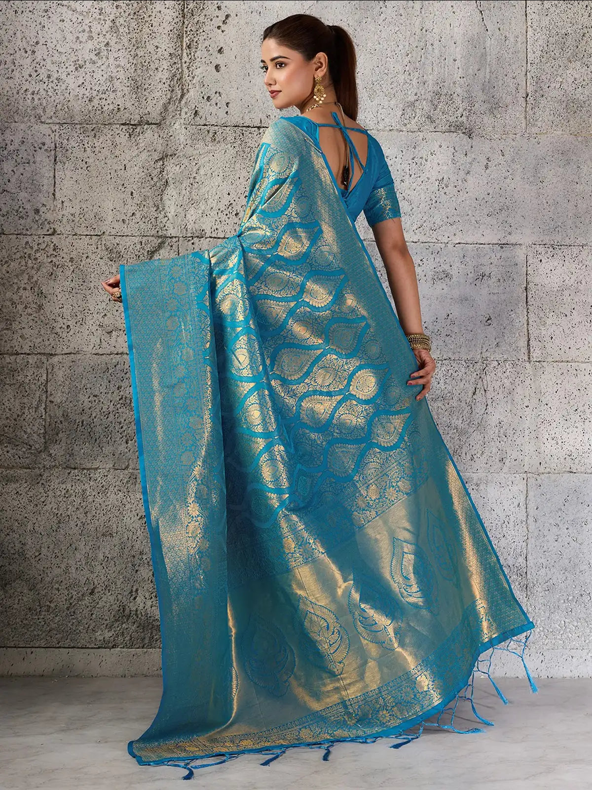 Tarani turquoise blue Kanjivaram silk blend saree back view with blouse tie and zari pallu