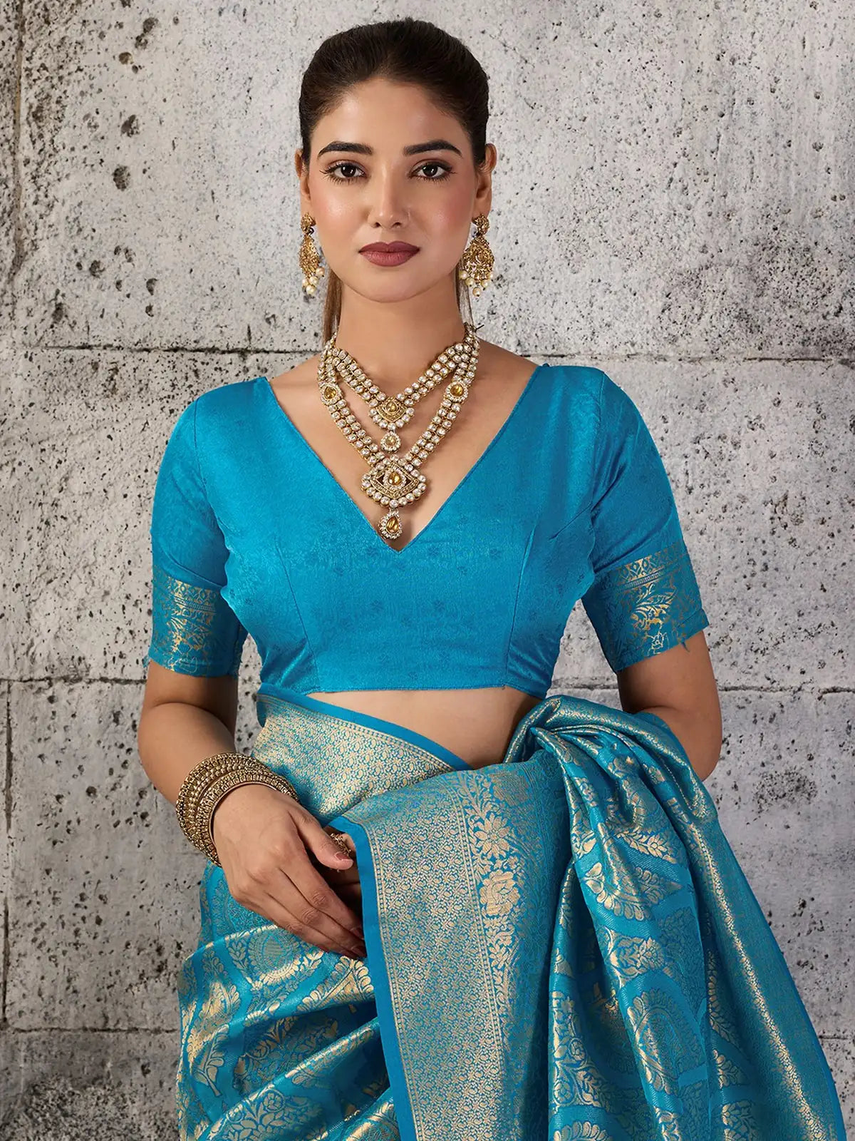 Tarani turquoise blue Kanjivaram silk blend saree upper body view with zari pallu and blouse