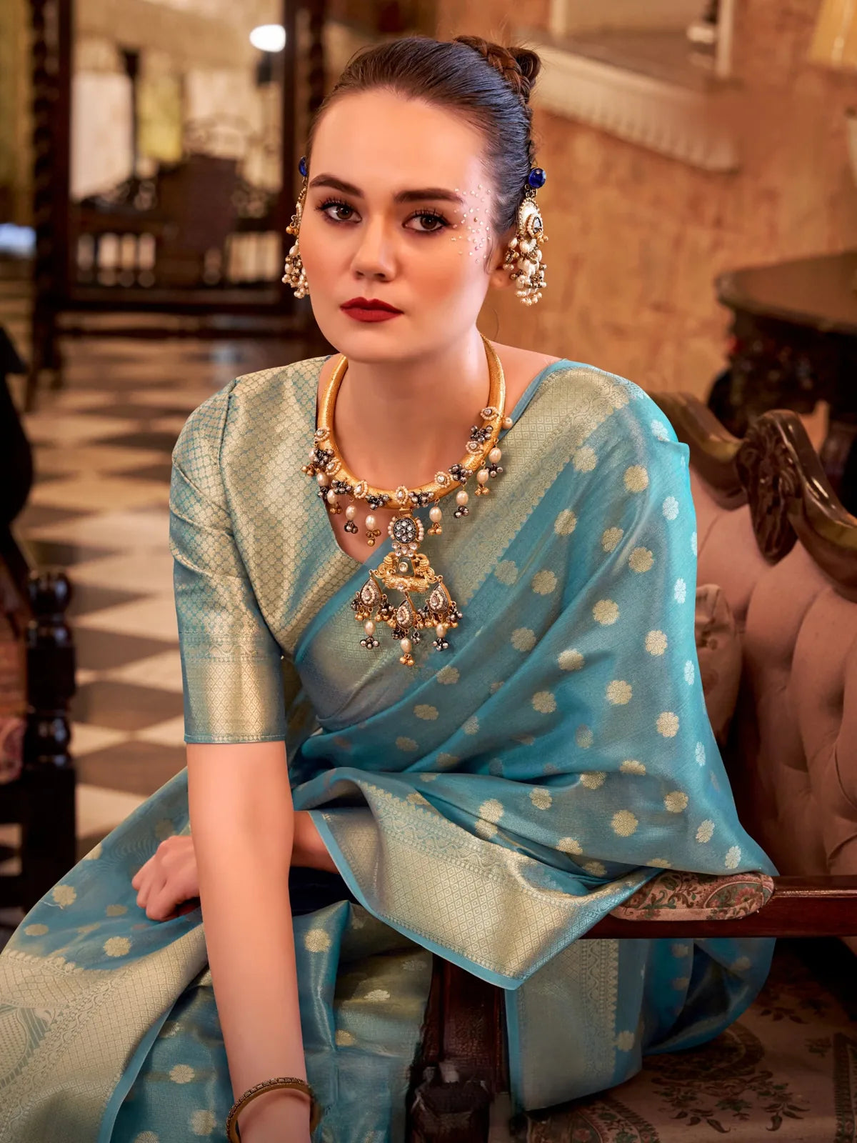 Tarani turquoise tissue silk saree upper body view with zari dots and matching blouse