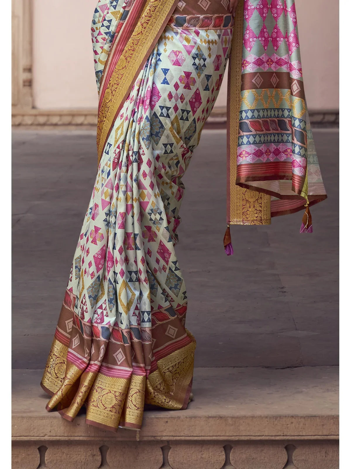 Tarani festive silk saree pallu view with rich zari border and colorful detailing
