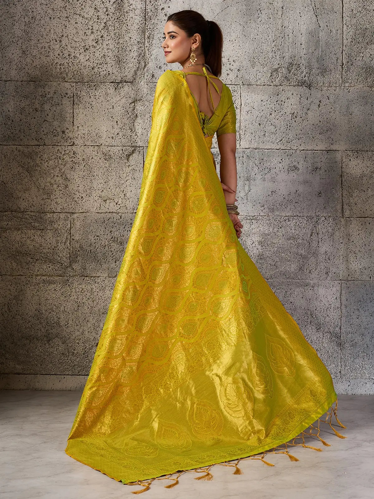 Tarani Rajvika yellow Kanjivaram silk blend saree back blouse and pallu view with zari work