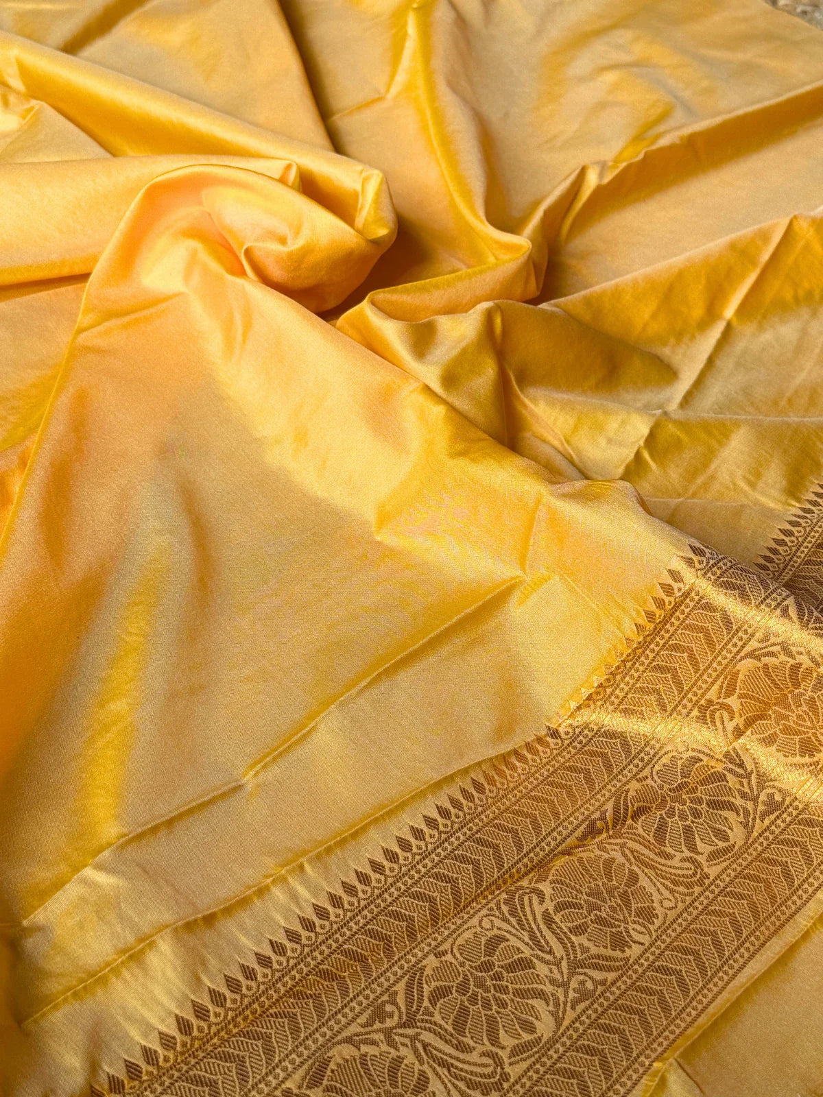 Tarani yellow silk saree closeup view highlighting zari and texture