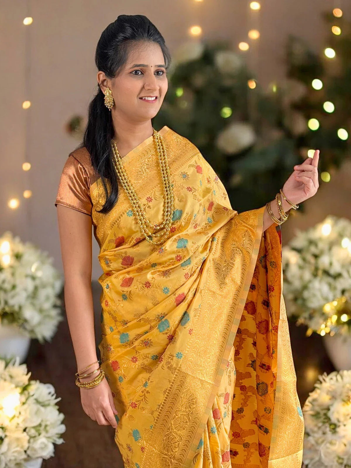 Tarani yellow silk saree front view with intricate woven detailing