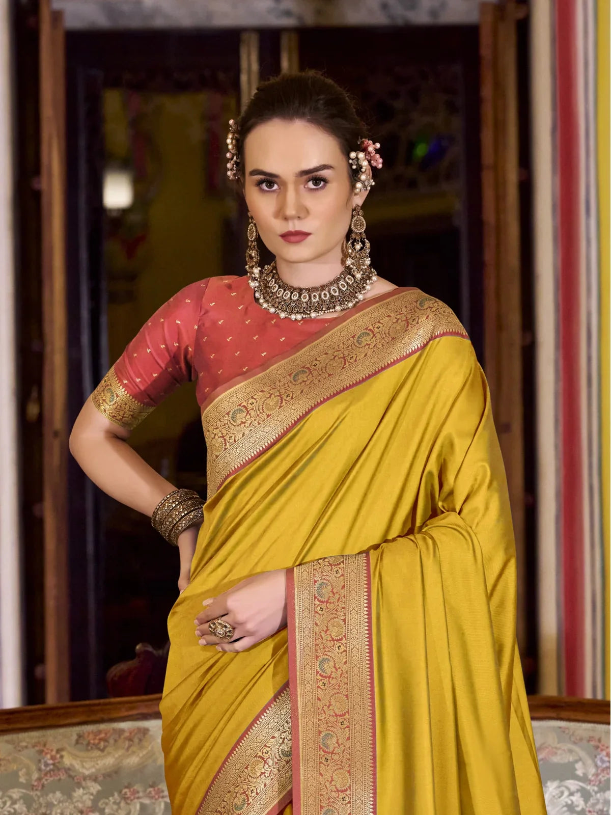 Tarani yellow silk saree front view with contrast blouse and golden border