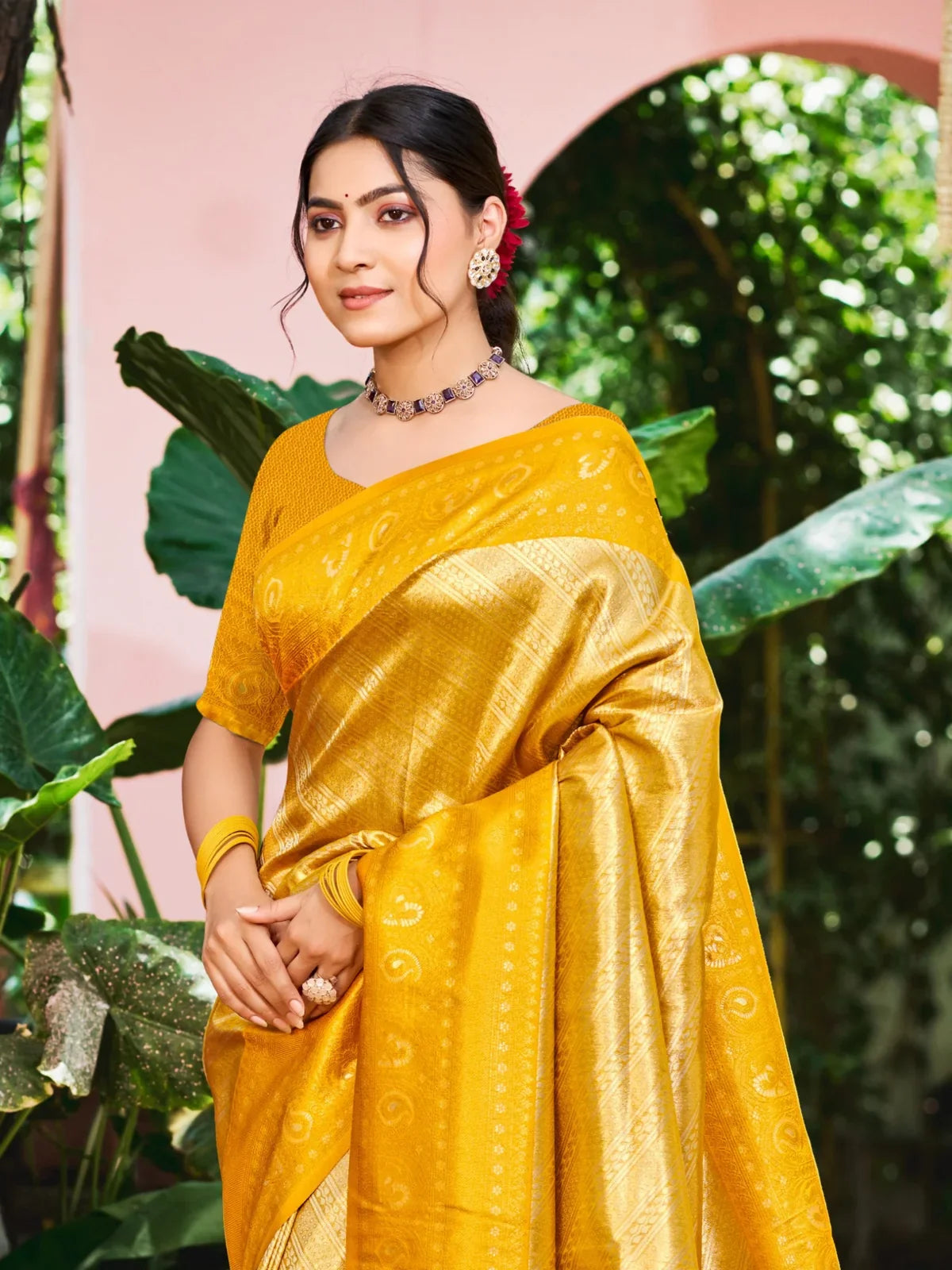 Tarani yellow Kanjivaram silk saree front view highlighting weaving design and festive drape