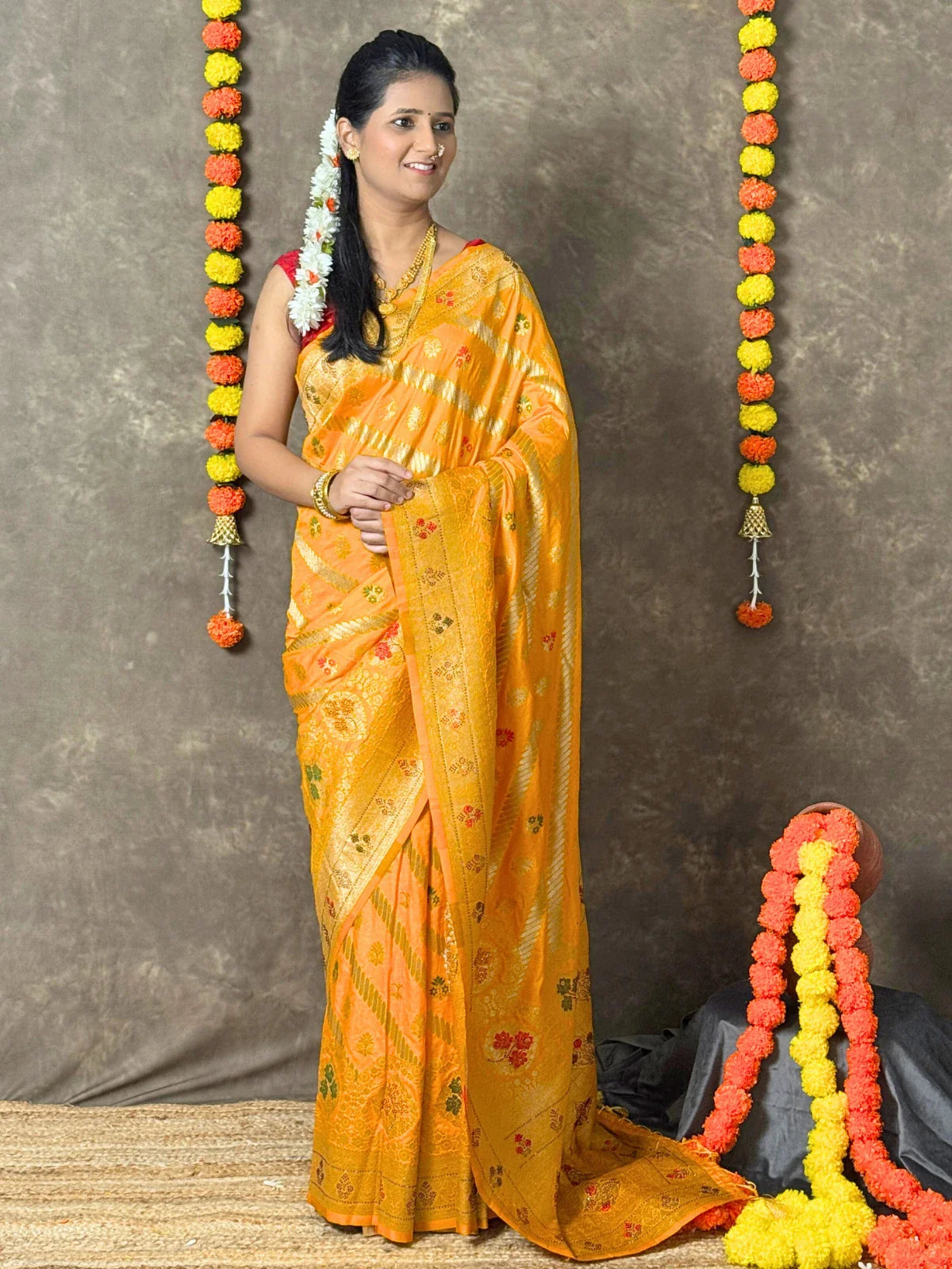 Tarani yellow woven silk saree full view with zari border and floral motifs for festive occasions