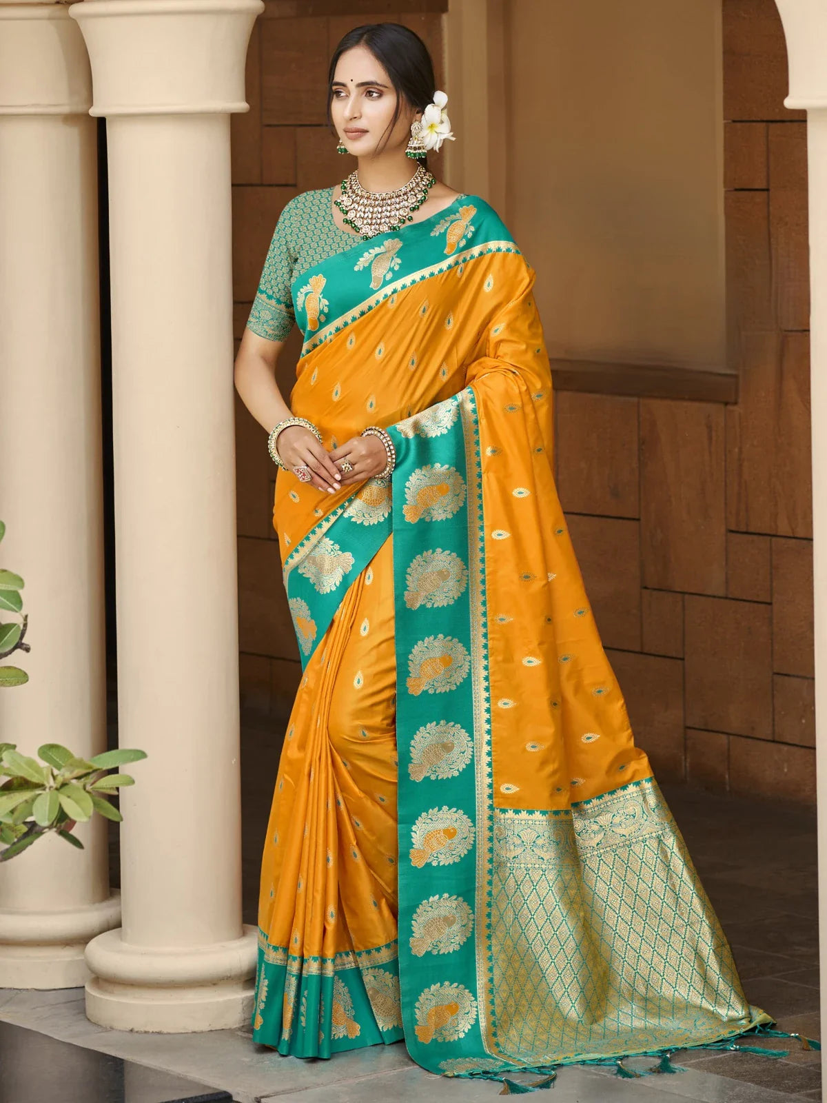 Tarani elegant yellow silk saree with green border and zari weaving shown in full view for weddings and festivals
