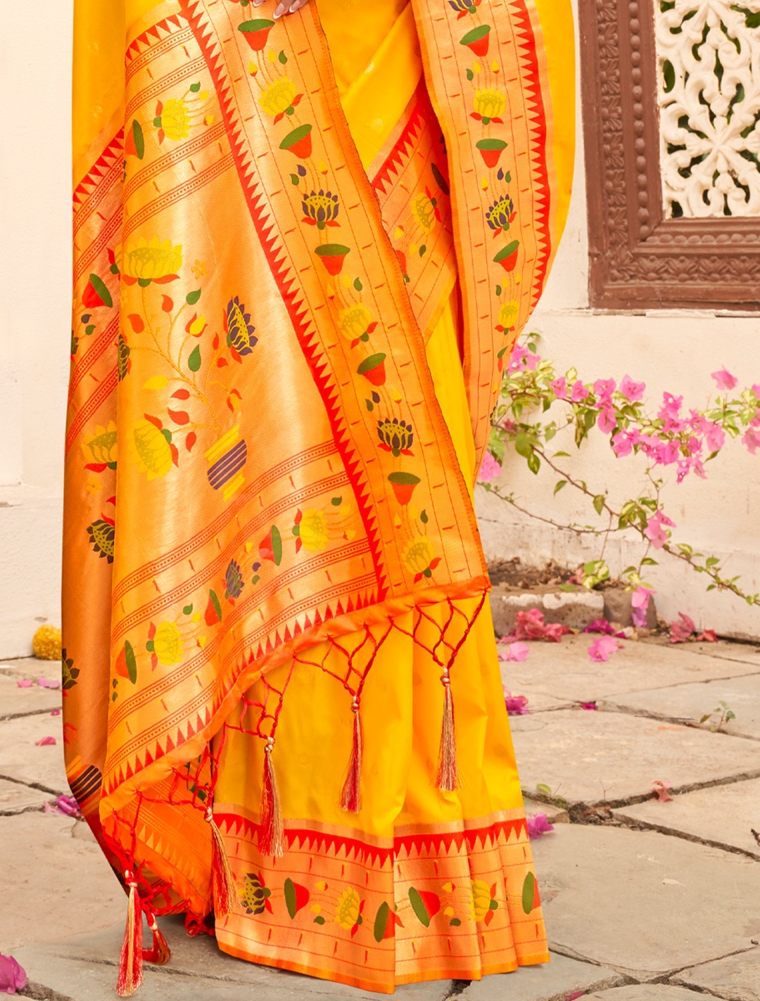 Tarani yellow Paithani silk saree with zari woven pallu closeup view highlighting floral motifs