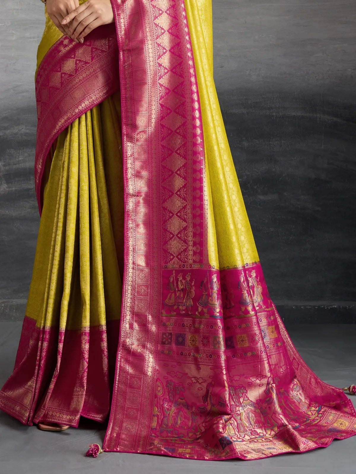 Tarani yellow silk saree pallu view with meenakari weaving and traditional motifs