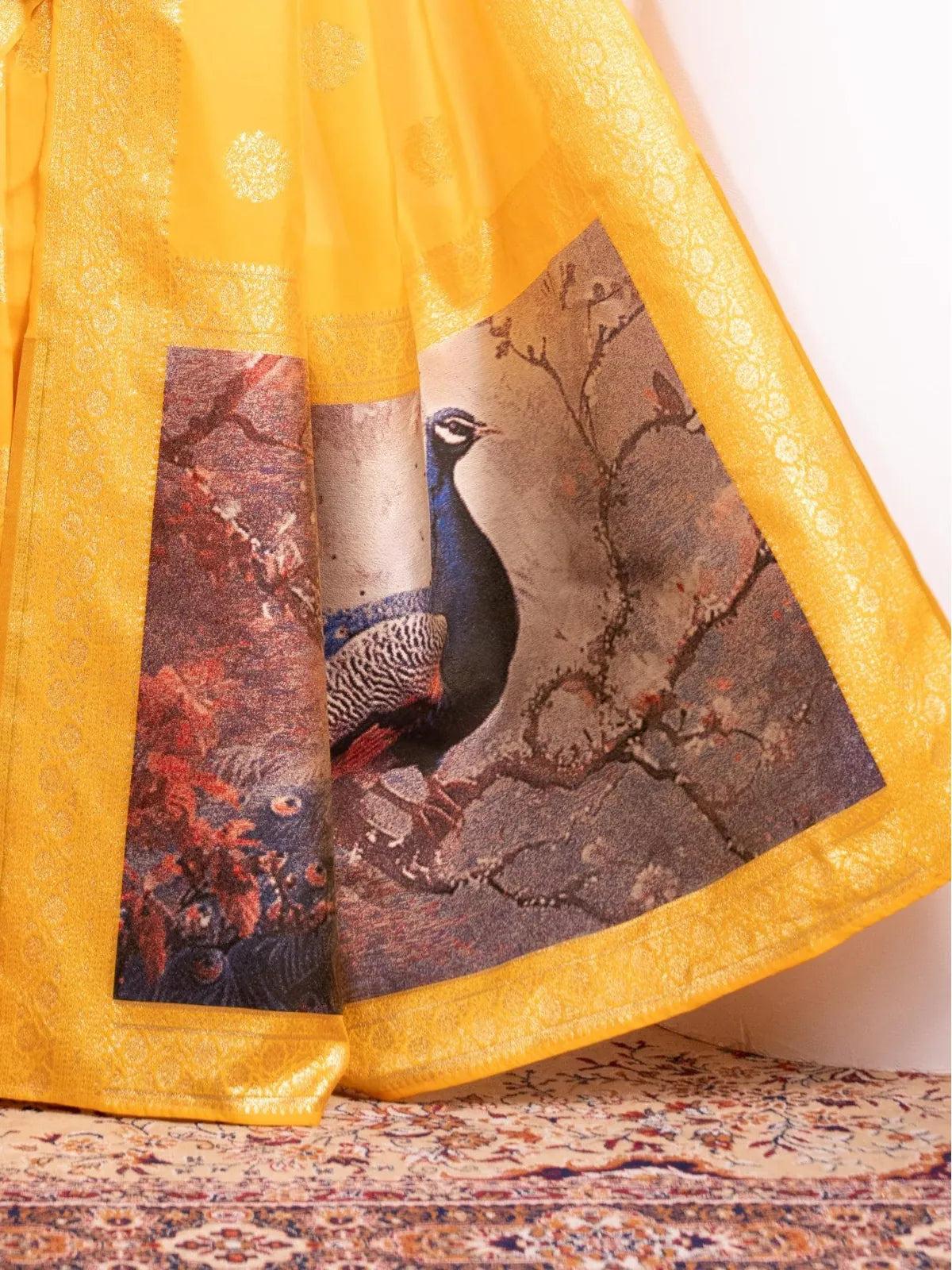 Tarani yellow saree pallu view with rich woven peacock design and intricate border detailing