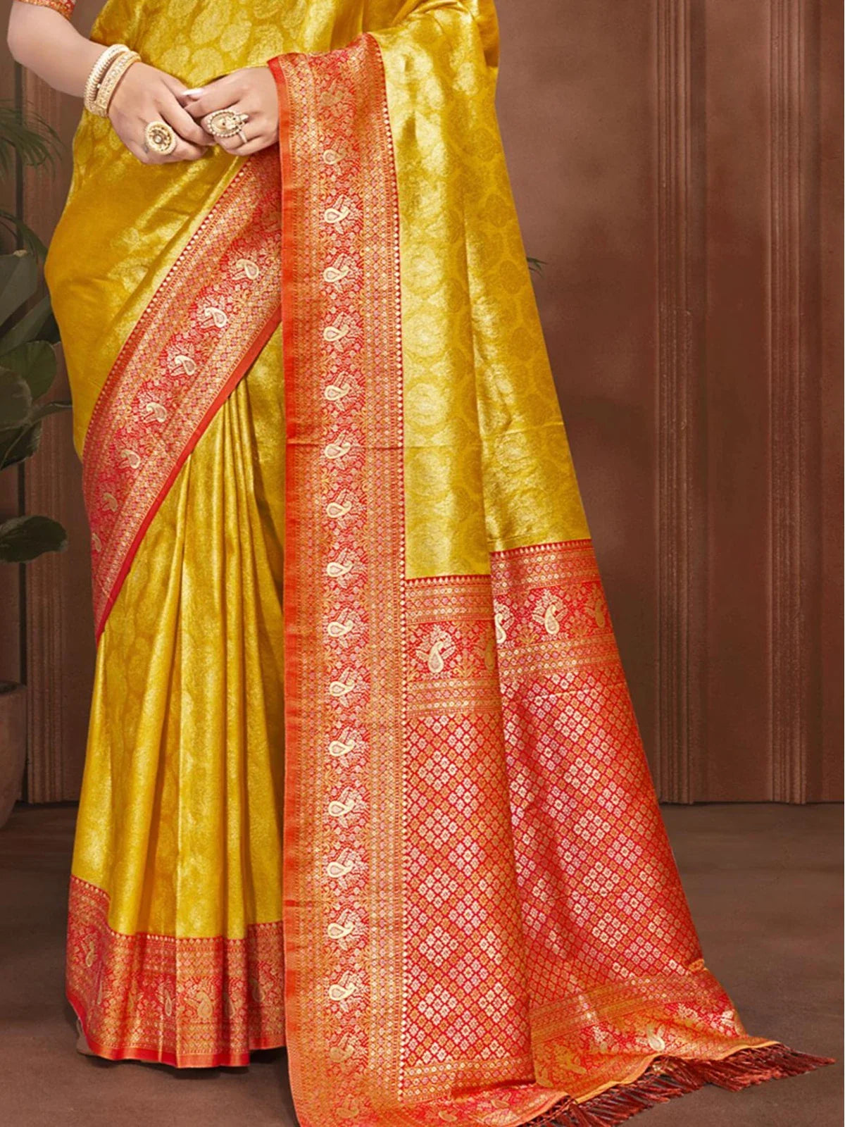 Tarani yellow Kanjivaram silk saree close pallu view with rich red zari detailing