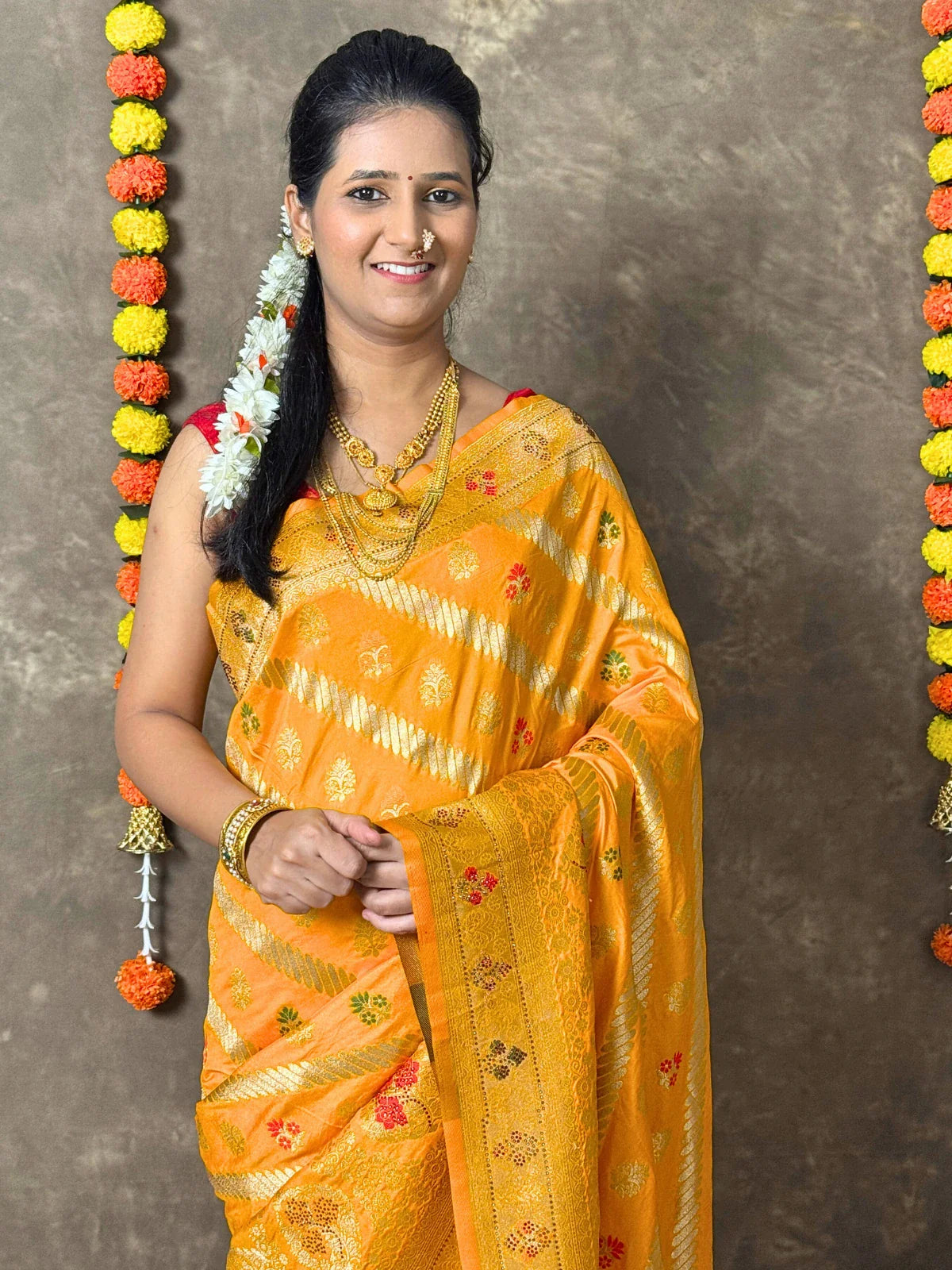 Tarani yellow silk saree upper body view styled with blouse and jewellery