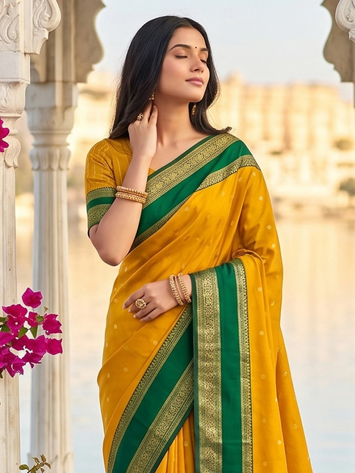 Tarani yellow soft silk saree upper body view with green contrast zari border and elegant blouse