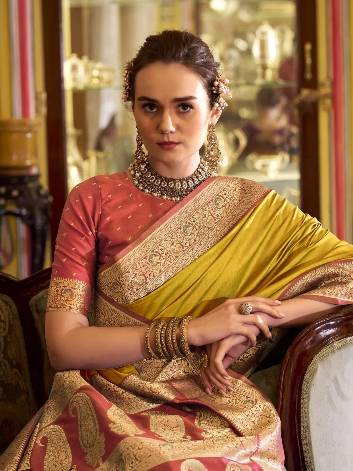 Tarani yellow silk saree with zari border upper body styling and jewellery