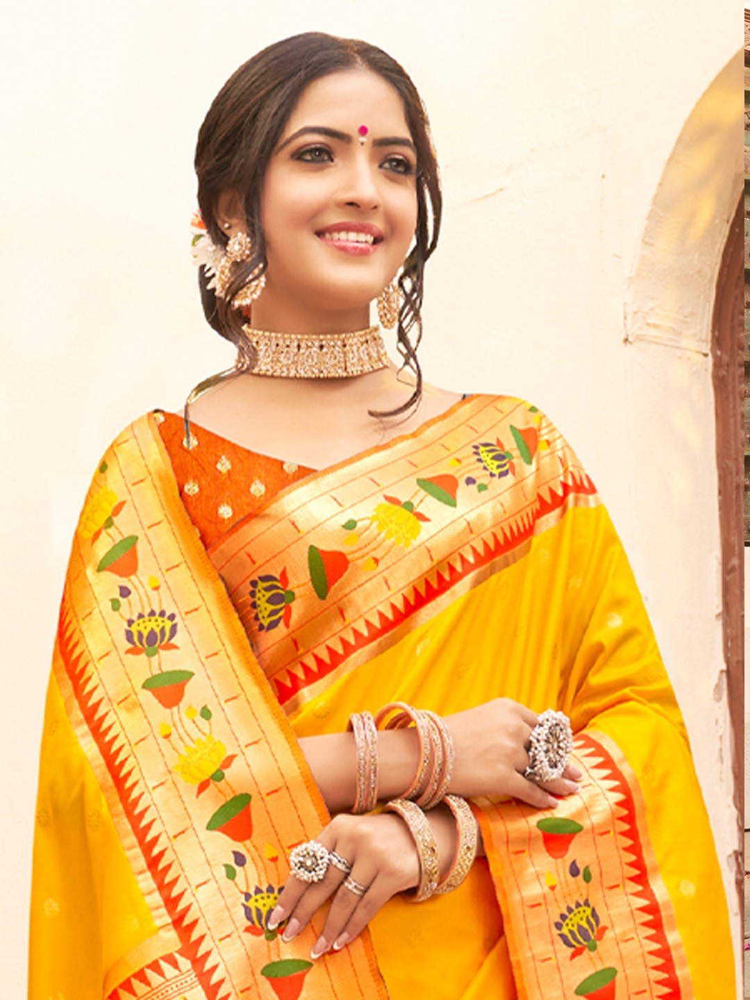 Tarani yellow Paithani silk saree with zari border upper body view showing blouse and drape