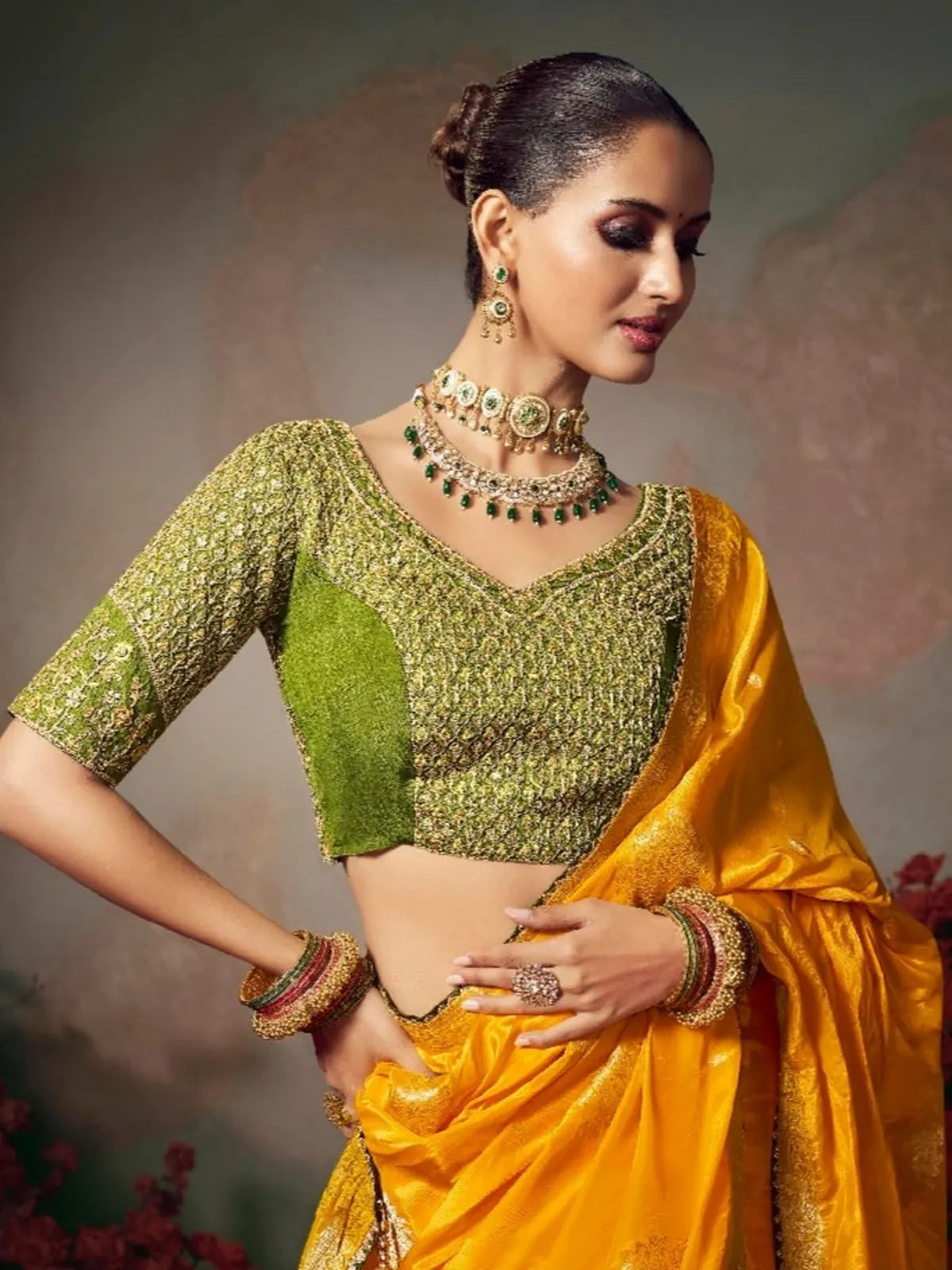 Tarani designer blouse close-up with detailed embroidery and V neckline in green