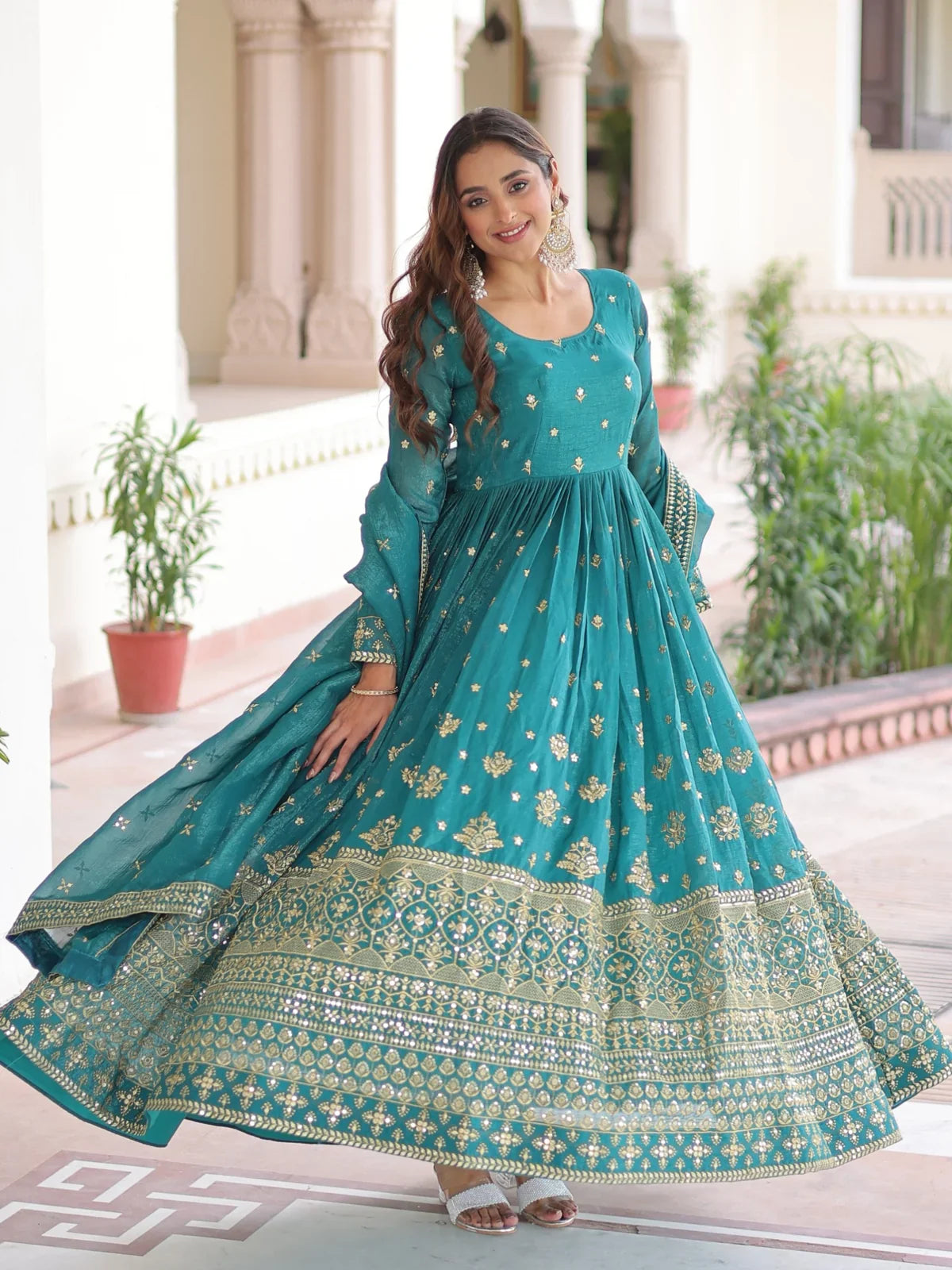 Tarani green silk gown front twirl view with full flair and zari border