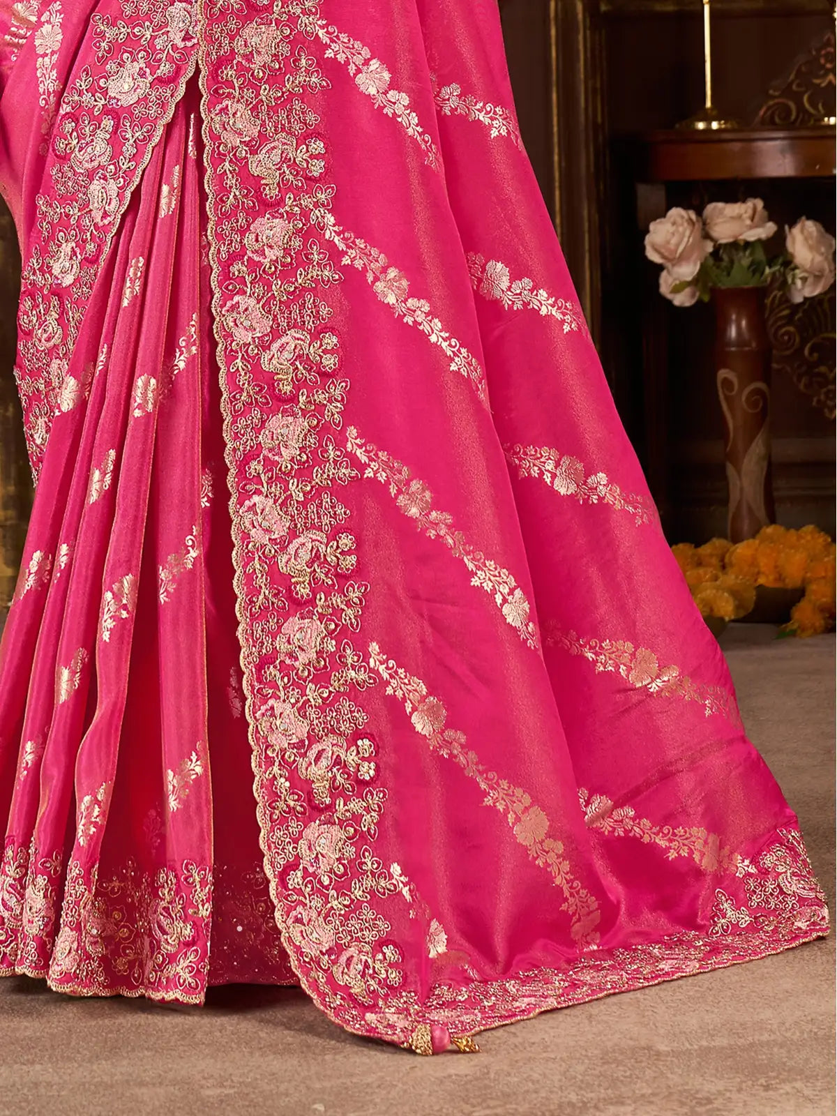 Tarani pallu view of soft pink fancy saree with zari embroidery and heavy latkan detailing