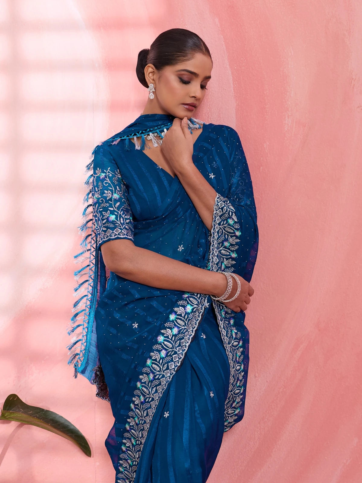Tarani navy blue solo chiffon saree pallu view with designer embroidered border and tassel detailing