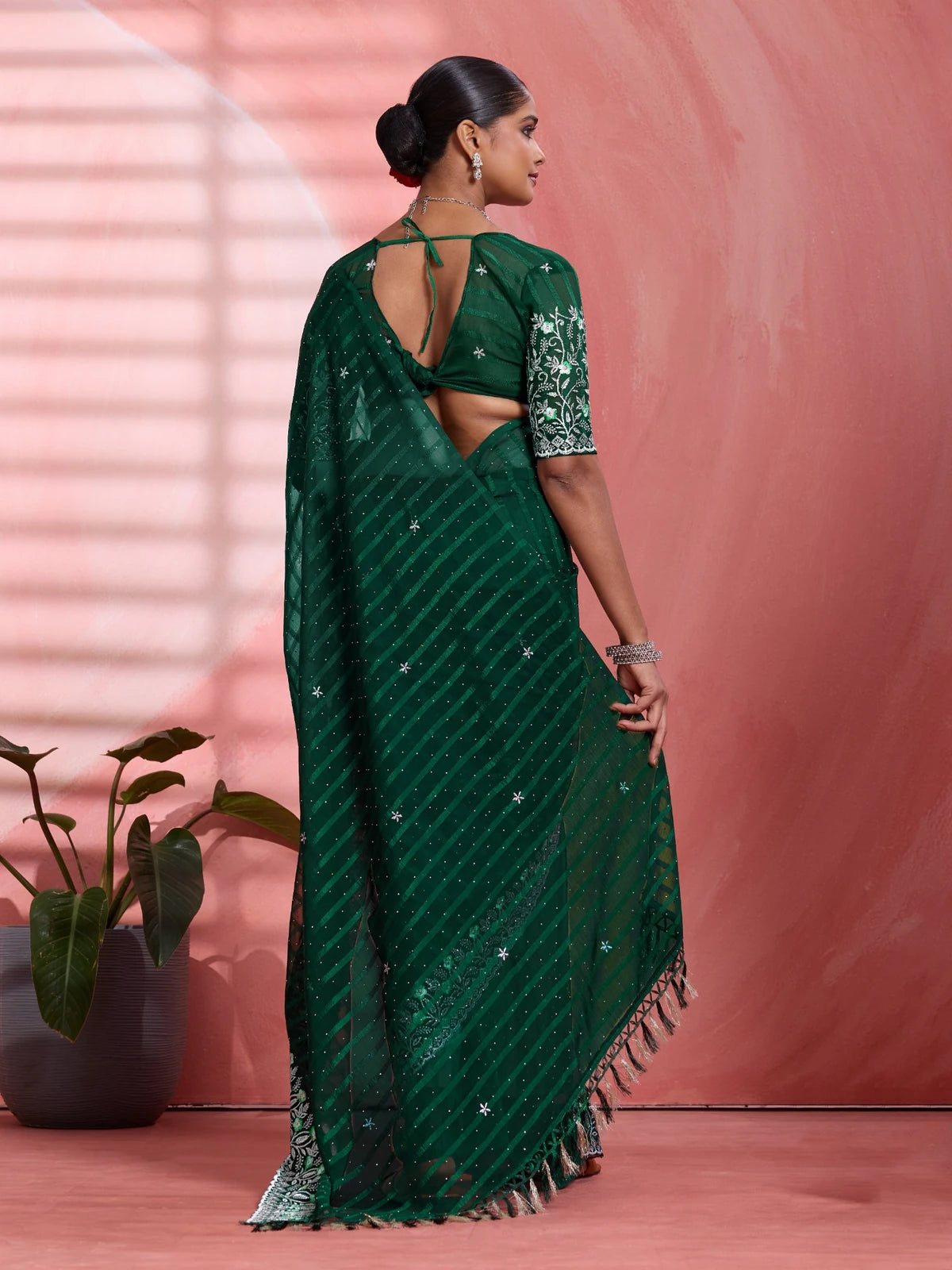 Tarani green solo chiffon saree back view with stylish blouse pattern for festive wear