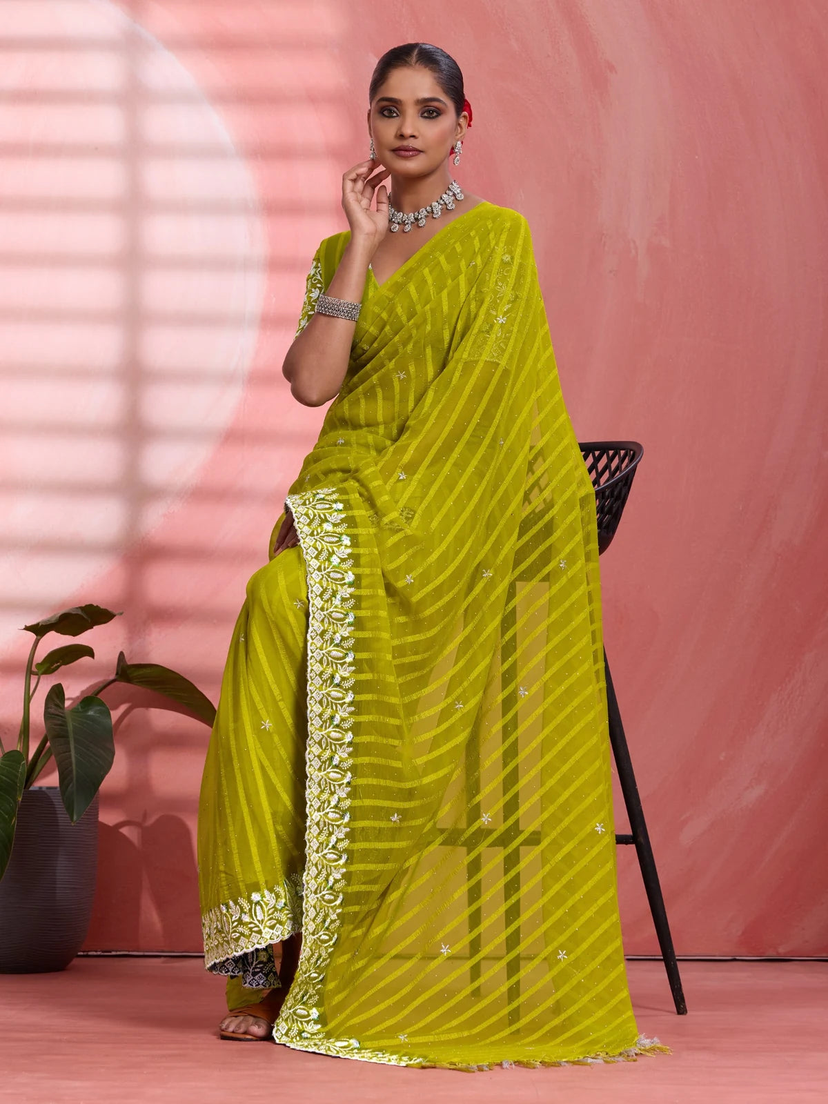 Tarani green festive chiffon saree pallu view with embroidered border detailing
