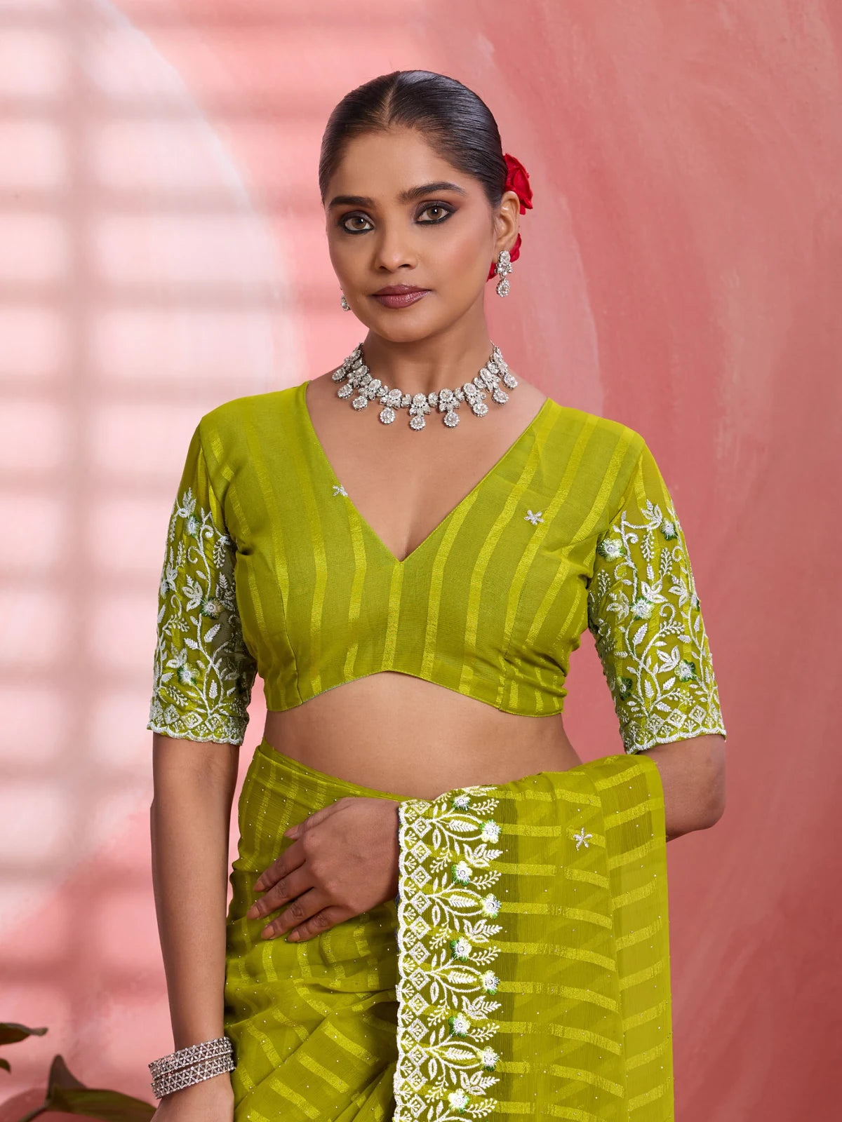 Tarani green solo chiffon saree blouse design upper body view with embroidered sleeves