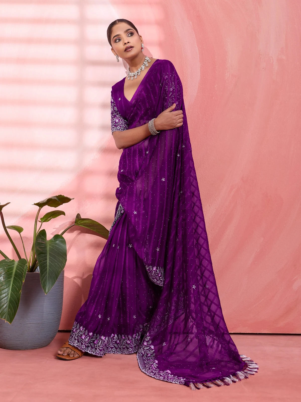 Tarani festive purple saree front pose with detailed pallu and shimmer work