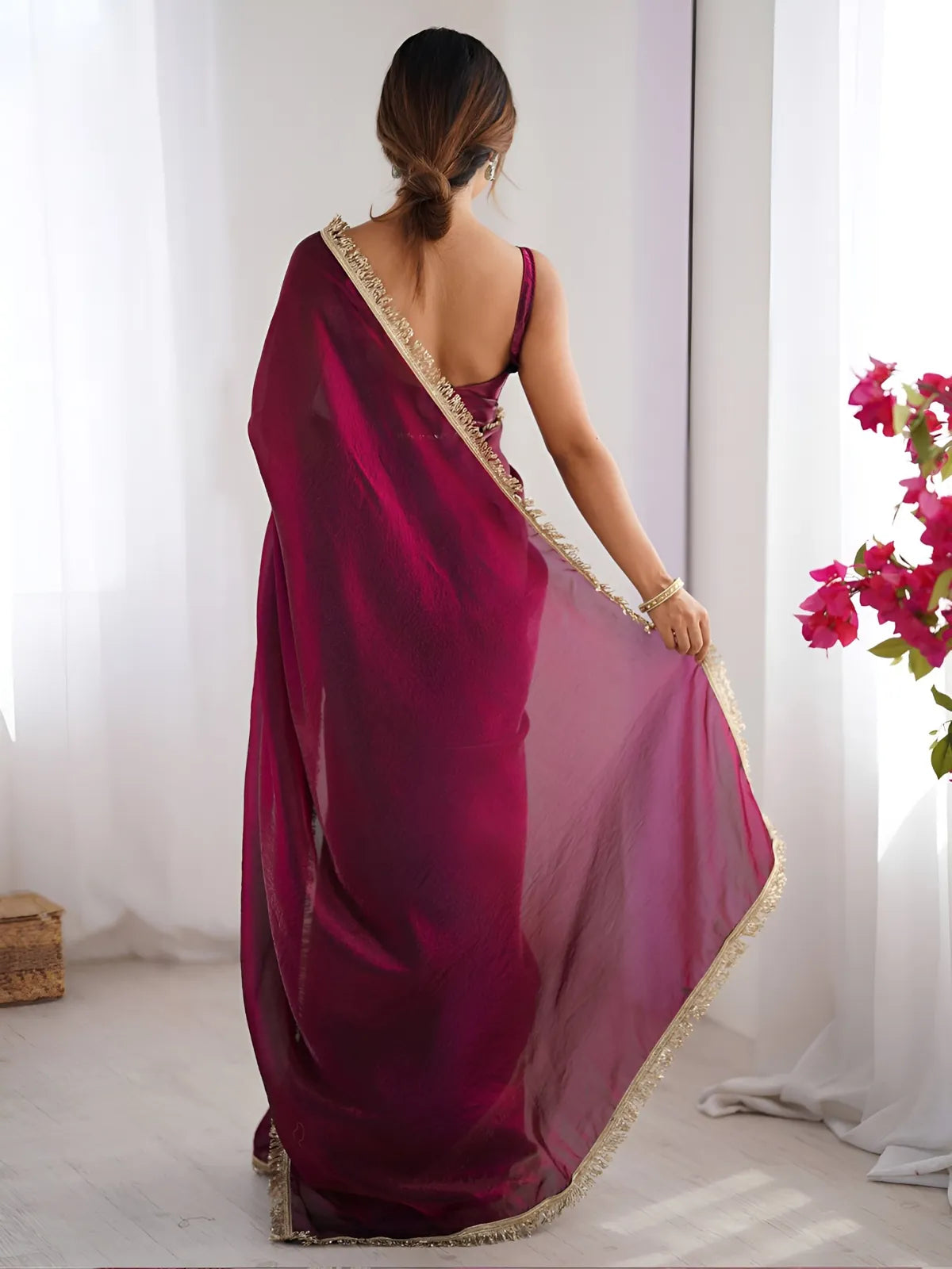 Tarani maroon space silk saree back pose showing sheer pallu and elegant drape