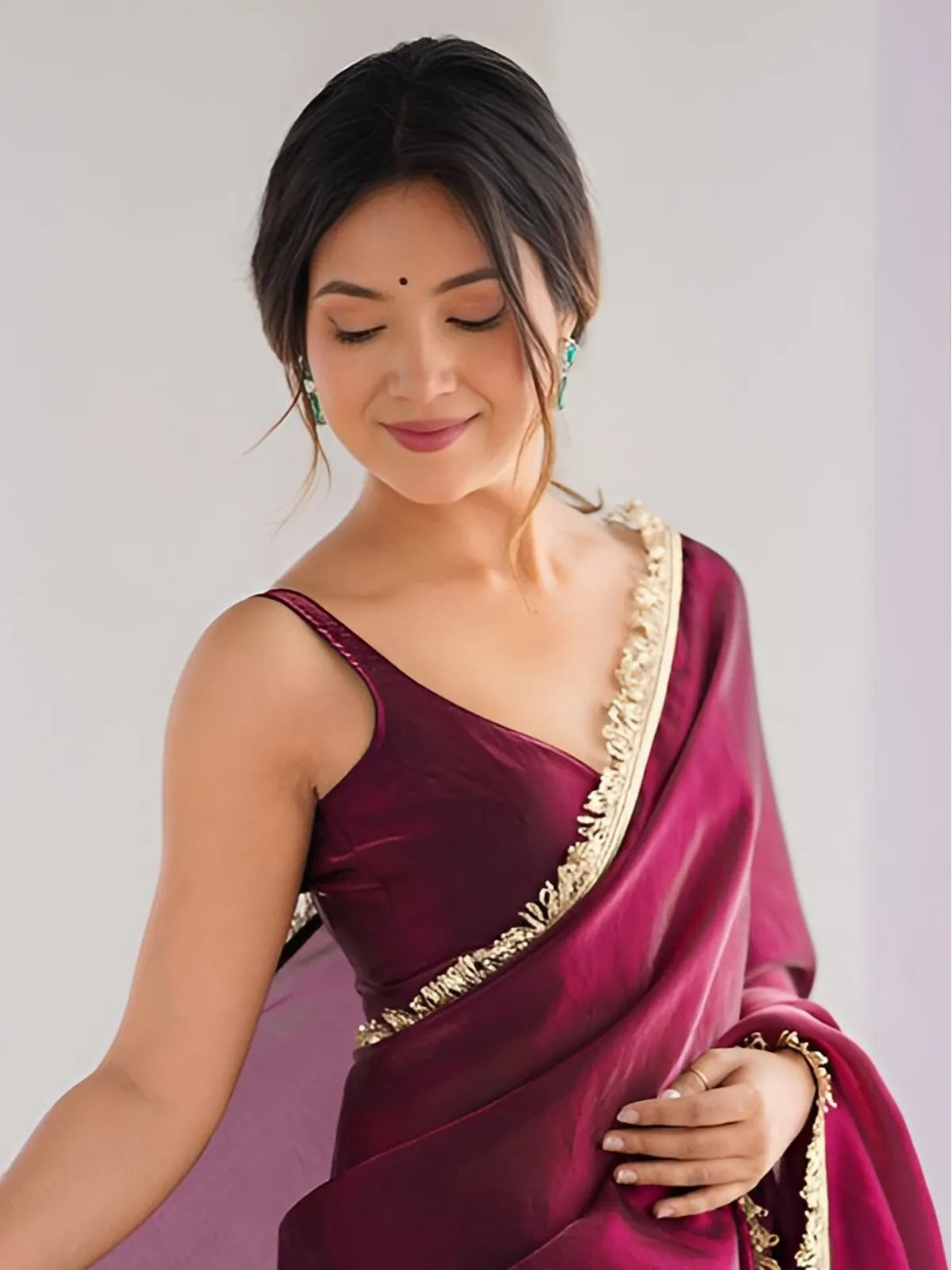 Tarani maroon space silk saree upper body close-up showing lace blouse and fall
