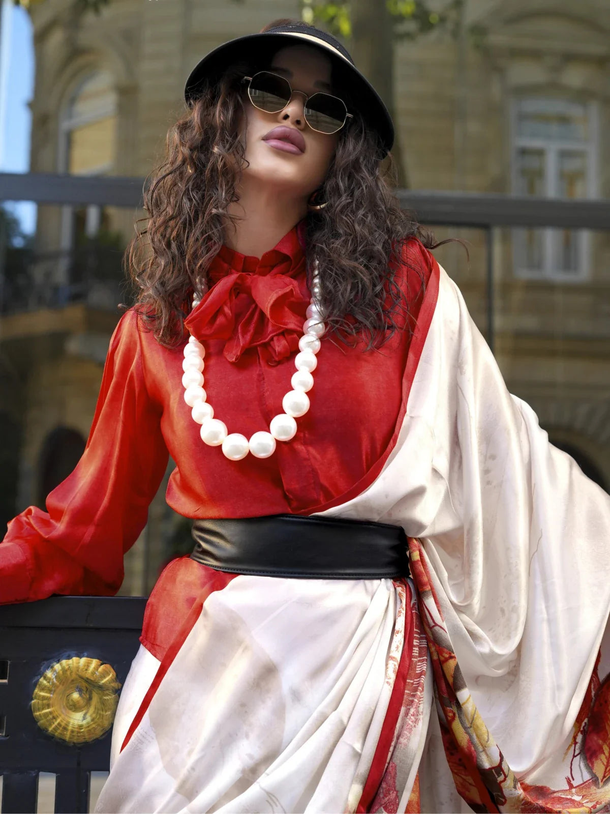 Tarani white satin saree with red blouse and pearl necklace â€“ upper body view