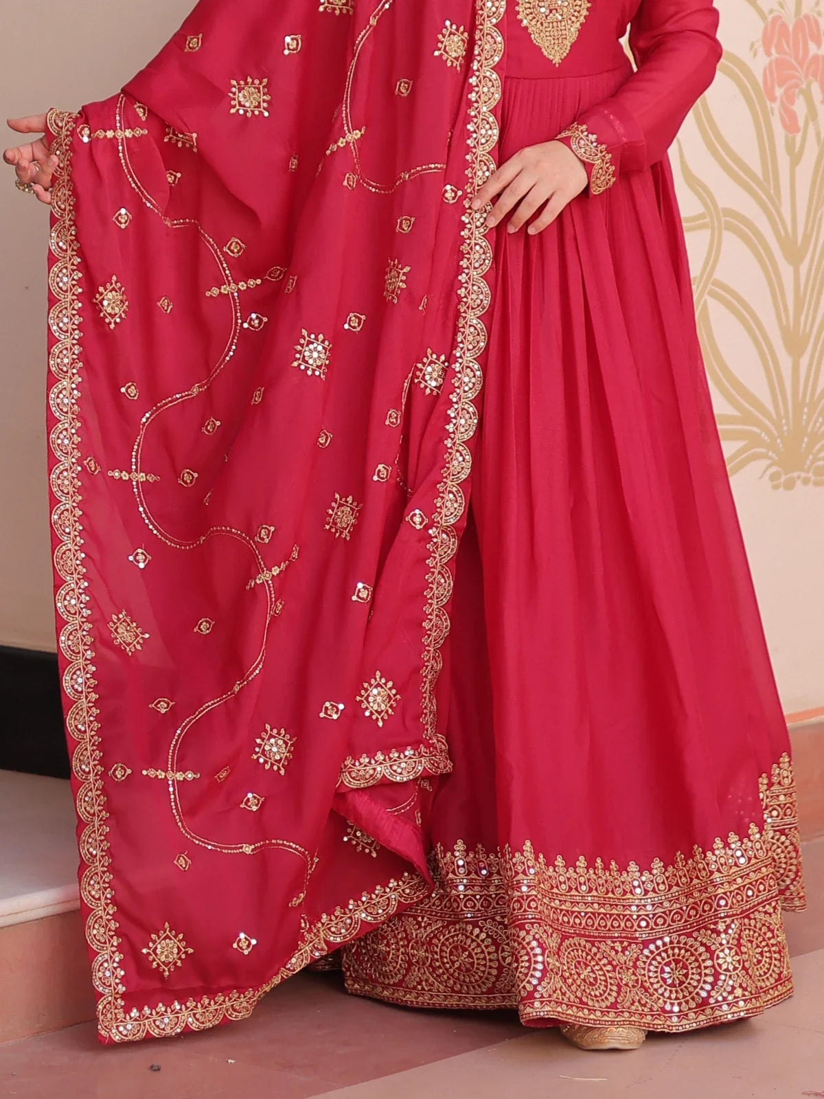 Tarani red georgette gown closeup showing zari and sequin detailed work