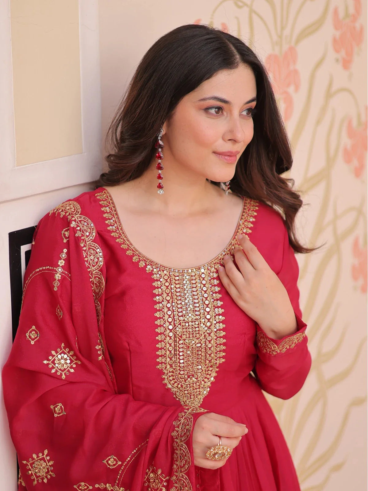 Tarani premium red gown upper body view showing intricate neckline embroidery