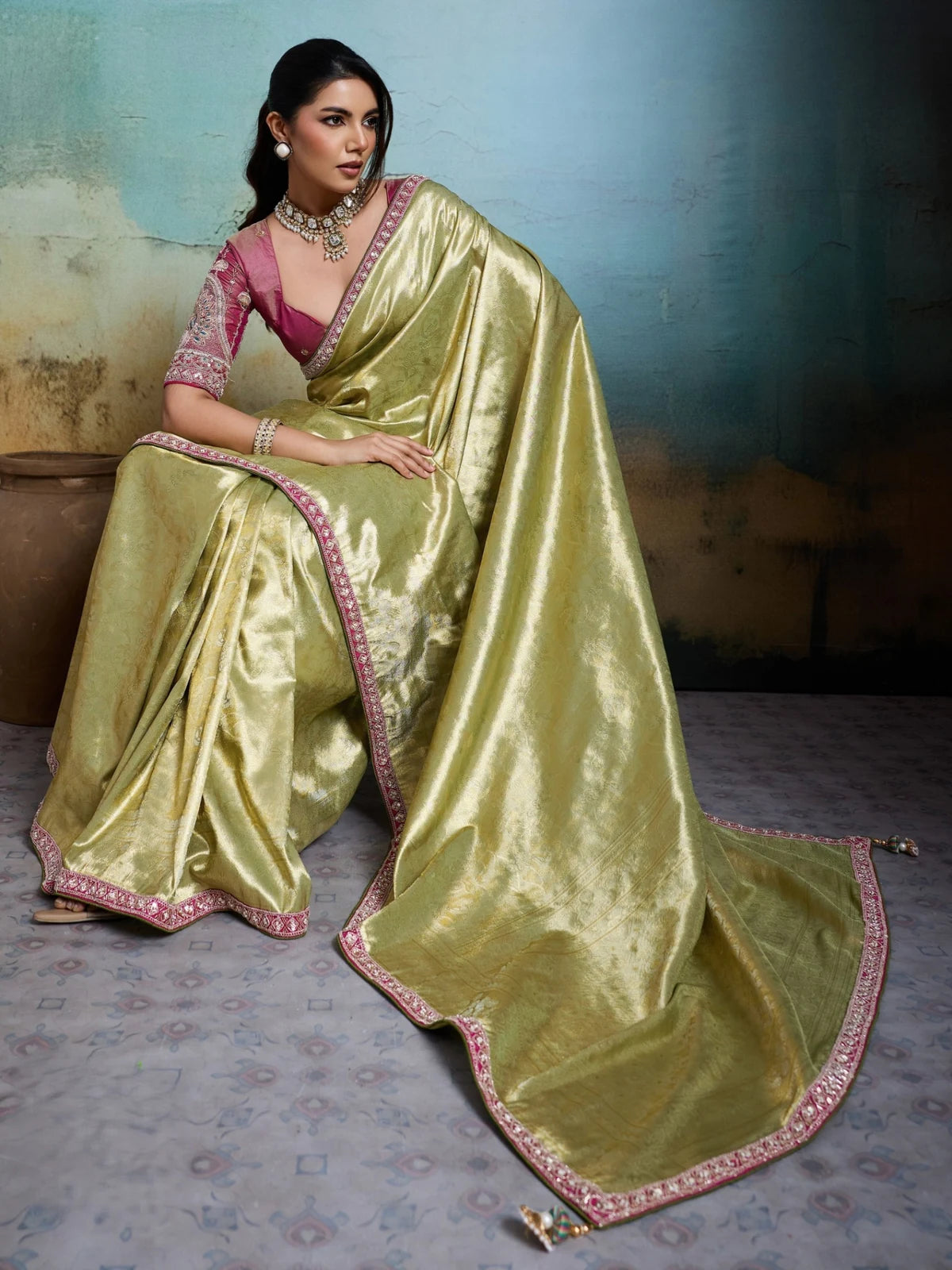 Tarani green woven tissue Banarasi saree with elegant pallu and border detailing