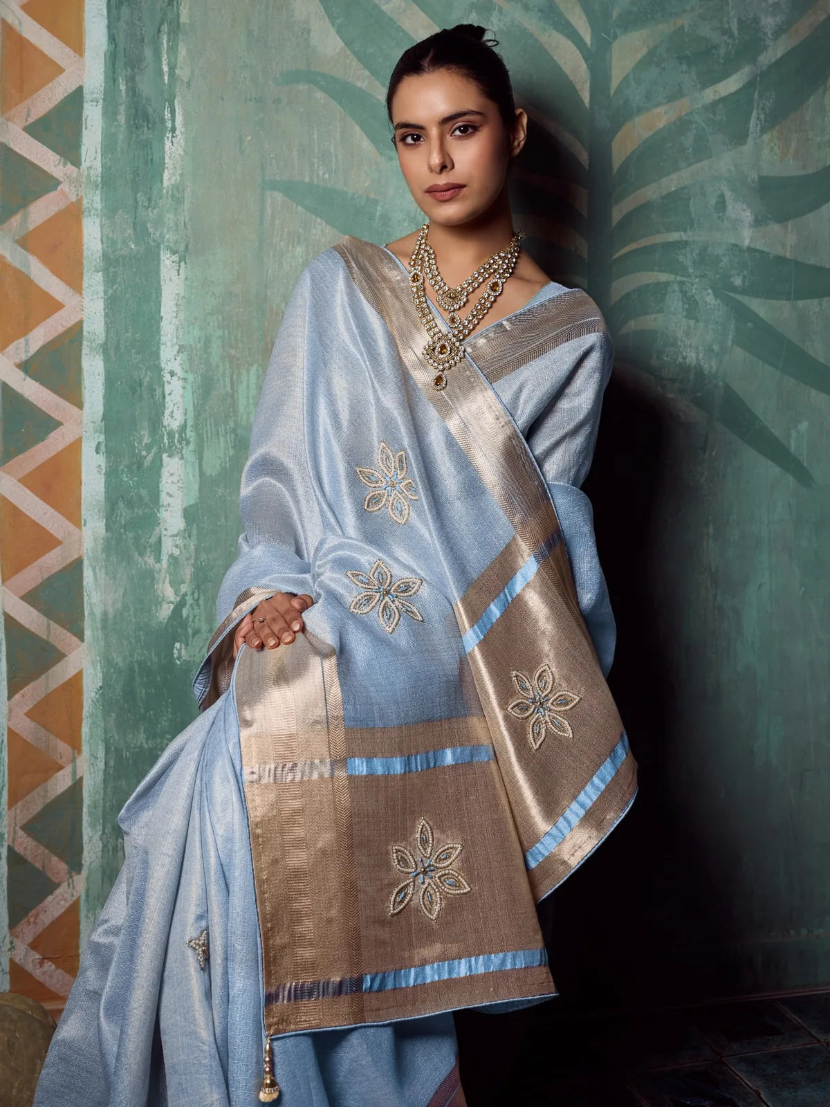 Tarani Maitri blue tissue cotton saree front view highlighting embroidered pallu and border