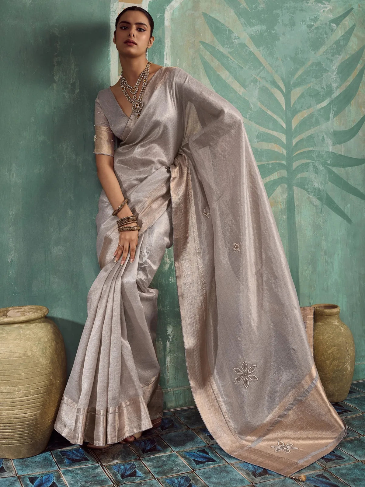 Tarani Mudra silver tissue cotton saree pallu view with metallic border, floral buttas and patta work