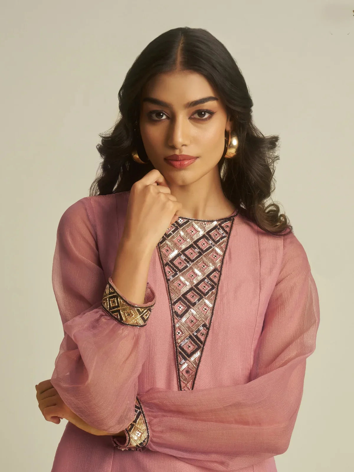 Tarani pink tissue festive dress with elegant handwork in closeup view